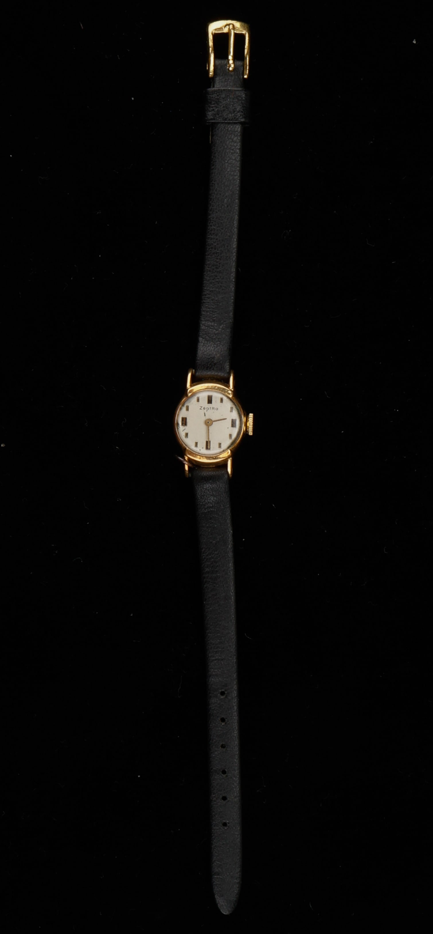 Vintage 18K Gold Zentra Ladies Wristwatch: Vintage 18K Gold Zentra Ladies Wristwatch. Back of case marked: 18K 0.750 1315 7 / 18854 / 50. Leather band. Length: 8" (20 cm). Approximate pennyweight 3.7 with out strap.