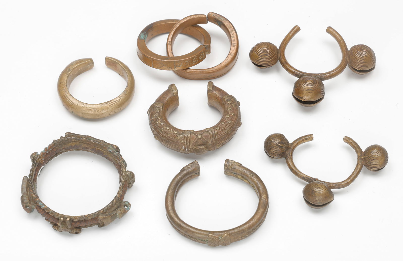 7 African Copper Alloy Bracelets: 7 African Copper Alloy Bracelets. Sizes From: 2.5'' x 3'' (6 x 8 cm); To: 5'' x 4'' (13 x 10 cm). Provenance: From the Collection of Richard Kempshall Meyer.