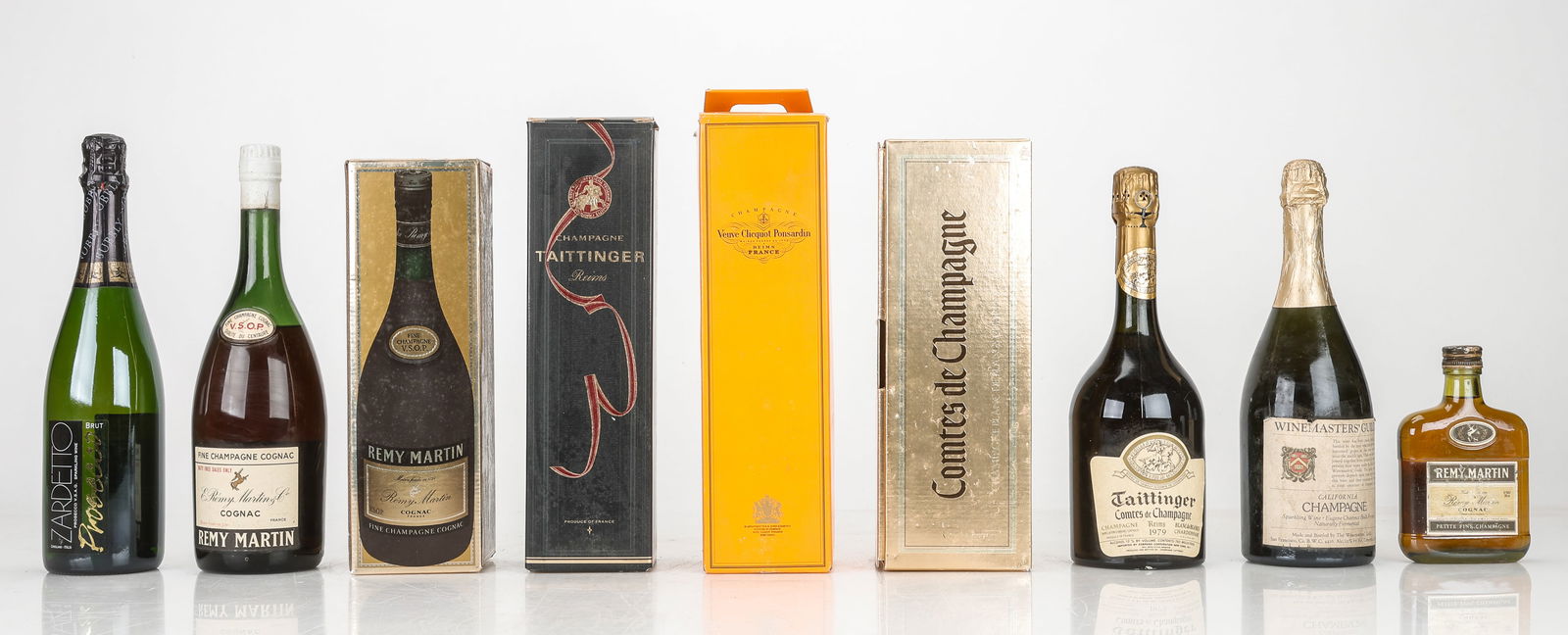 Nine Bottles of Assorted Champagne and Sparkling Wine: Nine Bottles of Assorted Champagne and Sparkling Wine. Including: Remy Martin (Petite Fine Champagne), 1980's, Remy Martin V.S.O.P. (Fine Champagne) (with box), 1970's, Remy Martin V.S.O.P. (Fine Cham