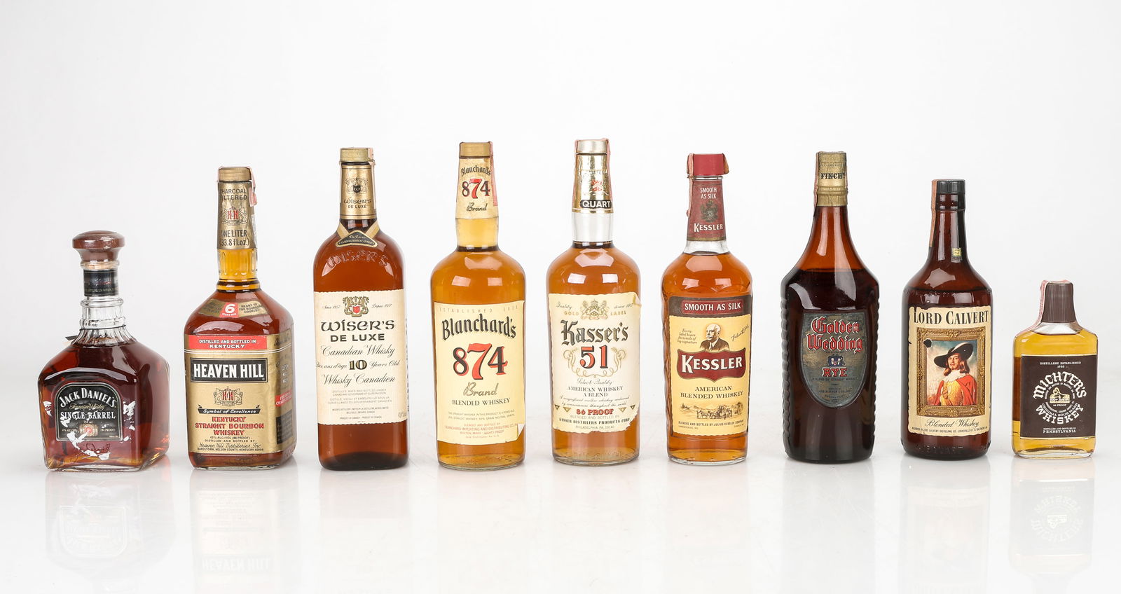 Nine Assorted Bottles of Whiskey: Nine Assorted Bottles of Whiskey. Including: Golden Wedding (Rye), Blanchard's 874 (Blended), Wiser's De Luxe (Canadian), Michter's (Sour Mash), Kasser's 51 (American Blended), Lord Calvert (American
