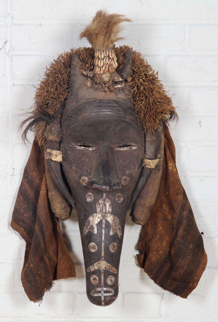 African Dan Tribe Fetish Mask: African Dan Tribe Fetish Mask. Wood Carved Crocodile with Headdress and Tin Accents. Size: 29" x 13" x 7". Provenance: William Murray