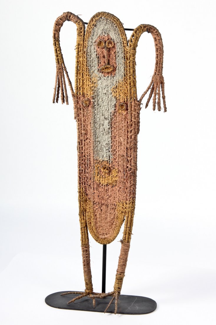 "Timbuwarra" Guardian Figure: Timbuwarra Guardian Figure, Southern Highlands, New Guinea, mid 20th c, woven natural fiber, pigments, stand included. Size: 38" x 15" (figure). Provenance: Jane Steinsnyder.
