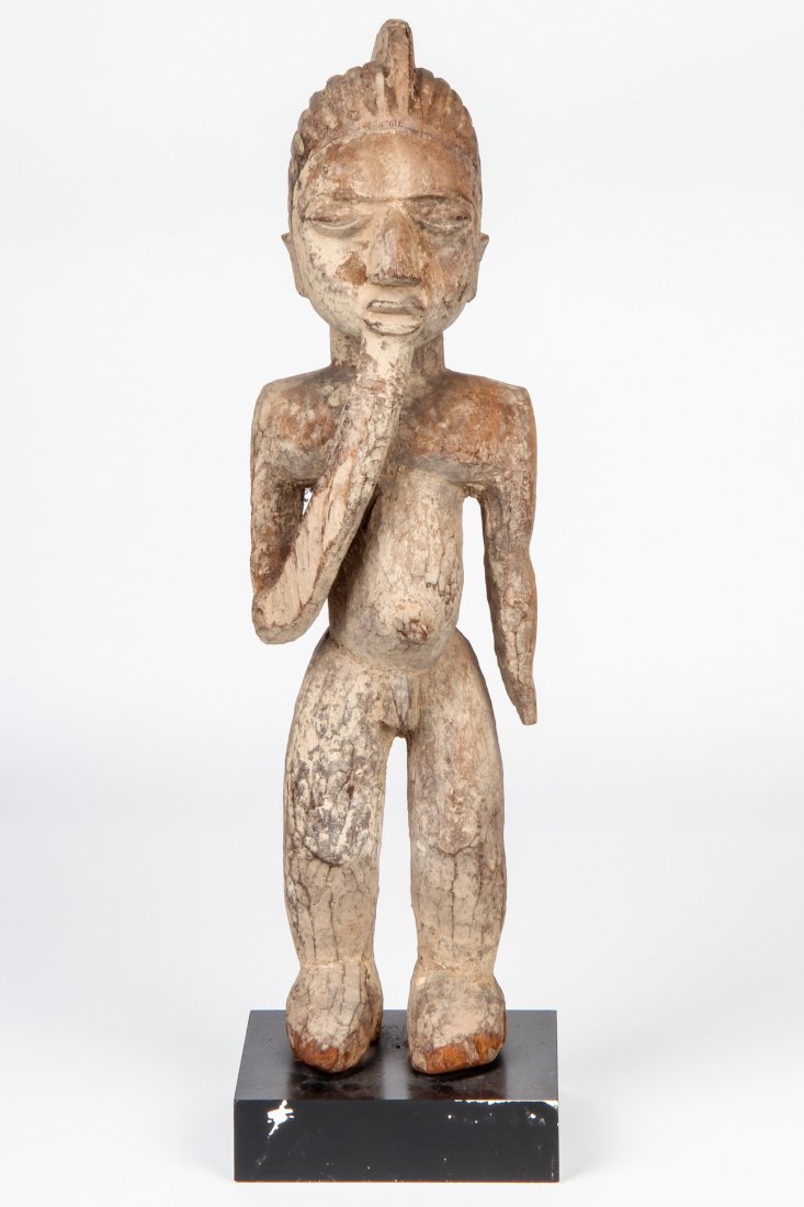 African Baule Figure: African Baule Figure, carved wood, stand. Size: 21" x 5.5" x 5". Provenance: ex collection Ben Bernstein; estate of Milton Ginsburg