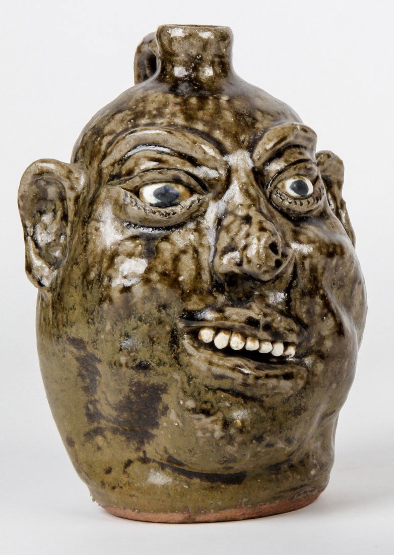 Lanier Meaders (1917-1998) Face Jug: Lanier Meaders (1917-1998), Face Jug. Size: 9.5" x 6" x 7". Medium: glazed ceramic. Provenance: George and Sue Viener collection.