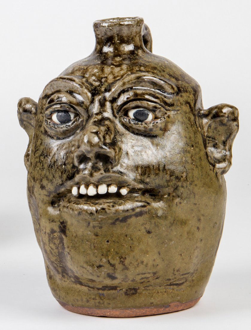 Lanier Meaders (1917-1998) Face Jug: Lanier Meaders (1917-1998), Face Jug. Size: 9.5" x 6" x 7". Medium: glazed ceramic. Provenance: George and Sue Viener collection.