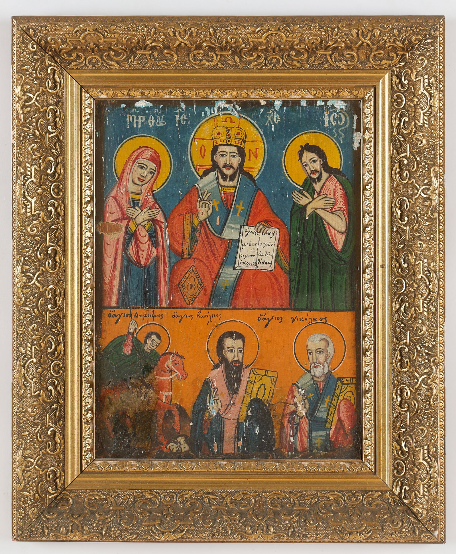 Antique Greek Icon: Antique Greek Icon. Tempera on board. Depicting Mary, Christ and St. John in the top register, over a lower register with Saints Demetrios, Basileus and Nicholas. Framed. Size: 13.5'' x 10'', 34 x 25