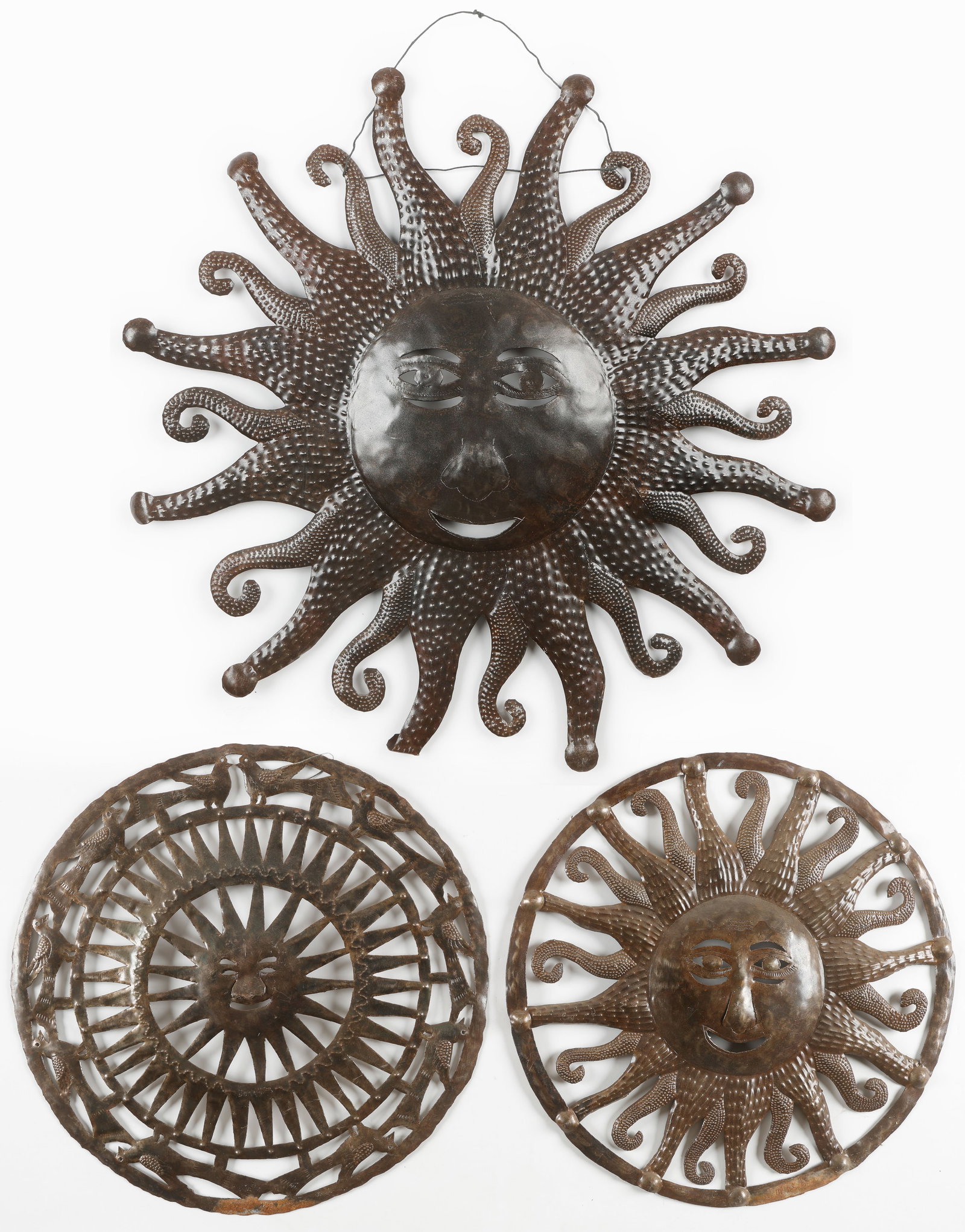 3 Haitian Cut Metal Wall Sculptures, Diam: 23" - 31": 3 Haitian Cut Metal Wall Sculptures. Sizes From: 23'' x 23'' x .5'' (58 x 58 x 1 cm); To: 31.5'' x 32.5'' x .5'' (80 x 83 x 1 cm). Provenance: Galerie Macondo.