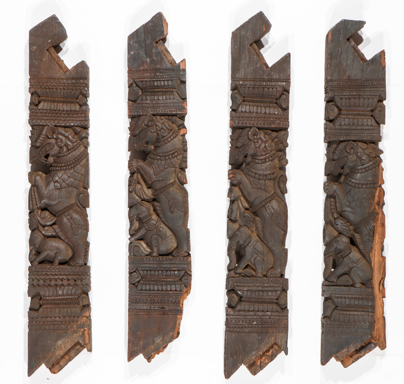 4 Antique Architectural Elements, India, Carved Wood, L: 41": 4 Antique Architectural Elements, India. Carved wooden brackets or corbels, likely late 19th century. Each Size approx.: 41'' x 7'' x 3.5'' (104 x 18 x 9 cm).