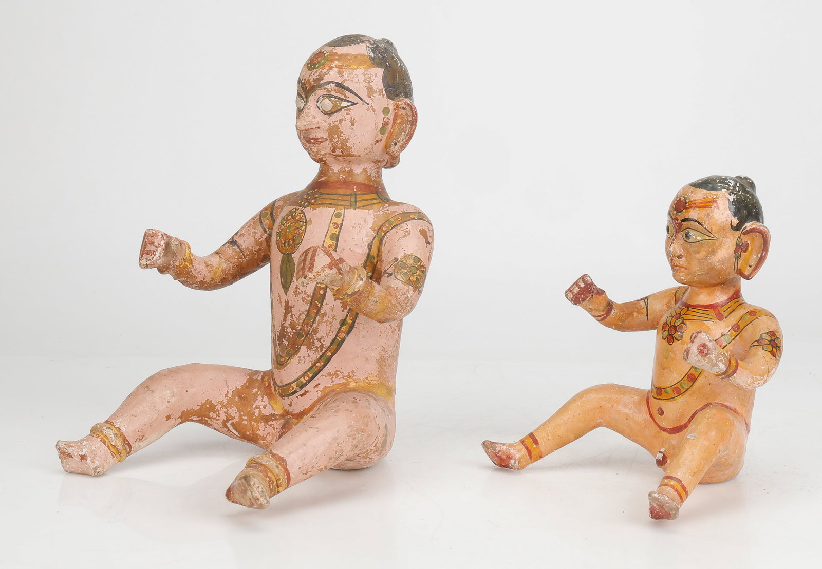 2 South-East Asian Painted Ceramic Hindu Figurines, H: 9"; 12.5": 2 Southeast Asian Painted Ceramic Hindu Figurines, Somewhat rustic ceramic figures covered in layers of paint. Sizes: 1) 9'' x 9'' x 7'' (23 x 23 x 18 cm); 2) 12.5'' x 9.5'' x 10'' (32 x 24 x 25 cm).