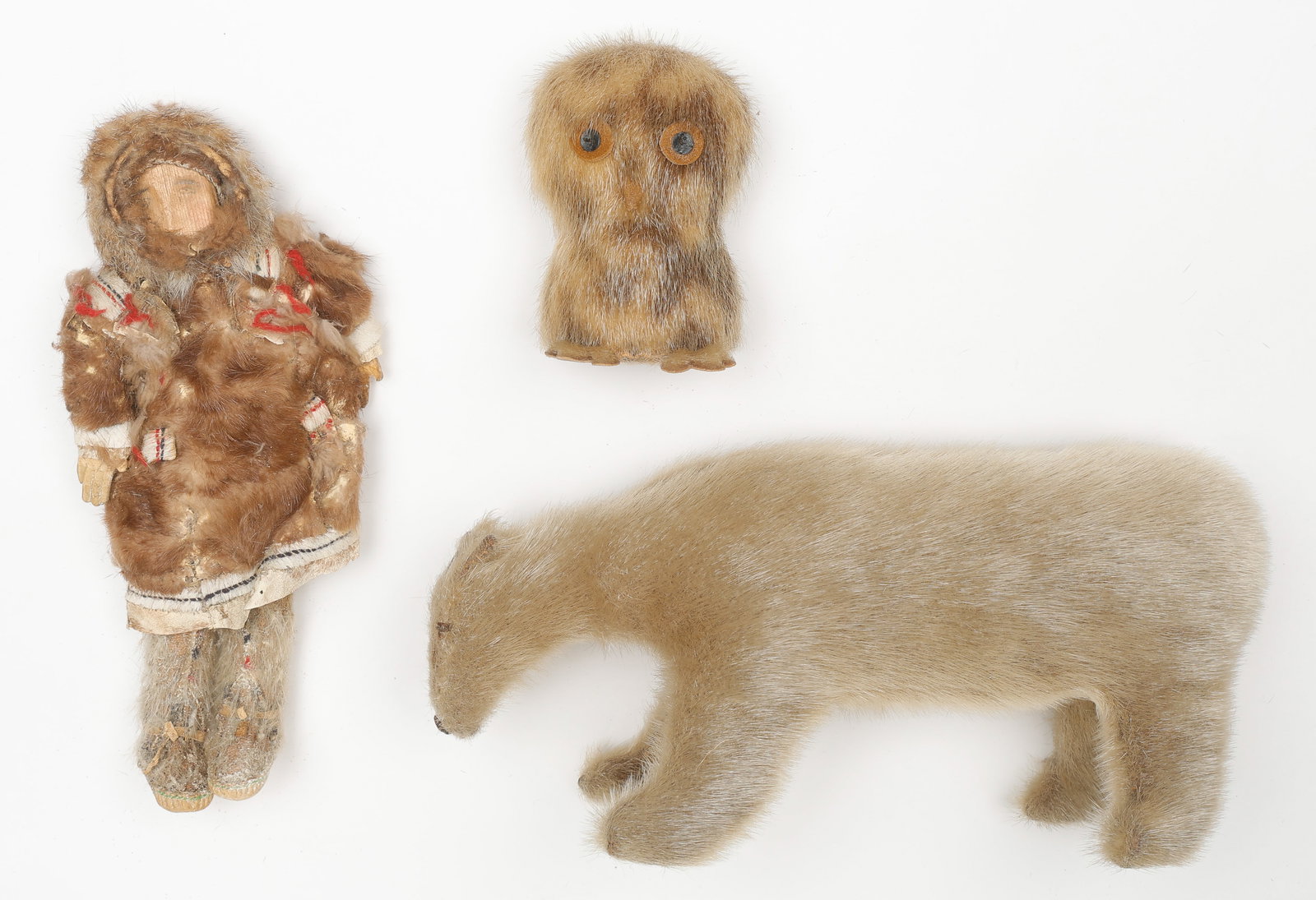 3 Vintage Inuit Figures: Inuk, Polar Bear And Owl, Sealskin: Vintage Innu / Inuit Figure of a Polar Bear, possibly Grenfell Mission, Labrador, Canada. Together with a Vintage Inuit Handcrafted Ookpik Owl. Sealskin. Sizes From: 4.5'' x 3.5'' x 1'' (11 x 9 x 3 cm
