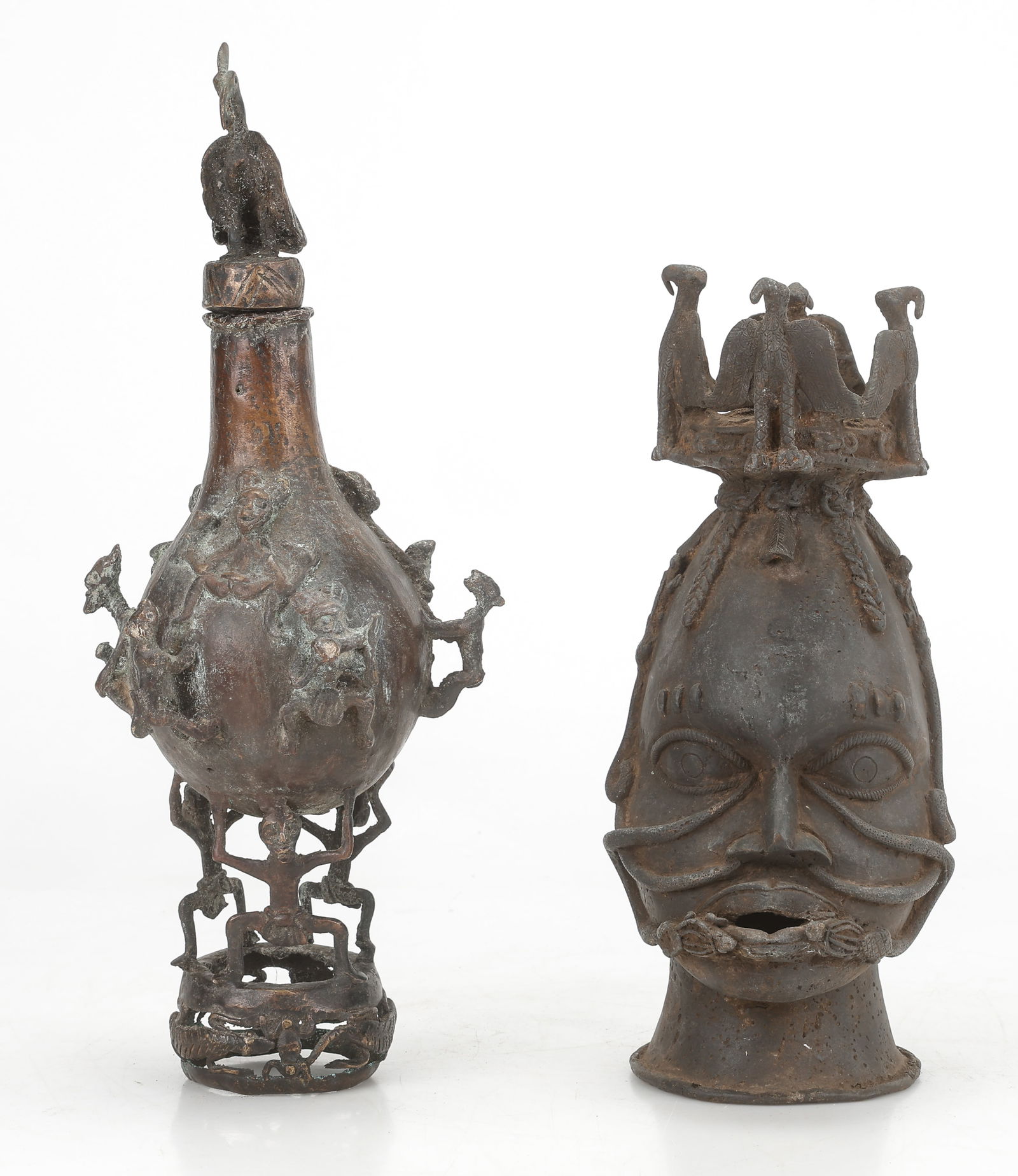 Benin Bronze Osun Head And A Tikar Bamun Palm Oil Vessel, H: 13", 17": Benin Bronze Osun Head. Size: 13'' x 5'' x 6'' (33 x 13 x 15 cm). And A Tikar Bamun Palm Oil Vessel. Size: 17'' x 6'' x 7'' (43 x 15 x 18 cm). Total weight: 13.5 lbs..Provenance: Collection of Charles