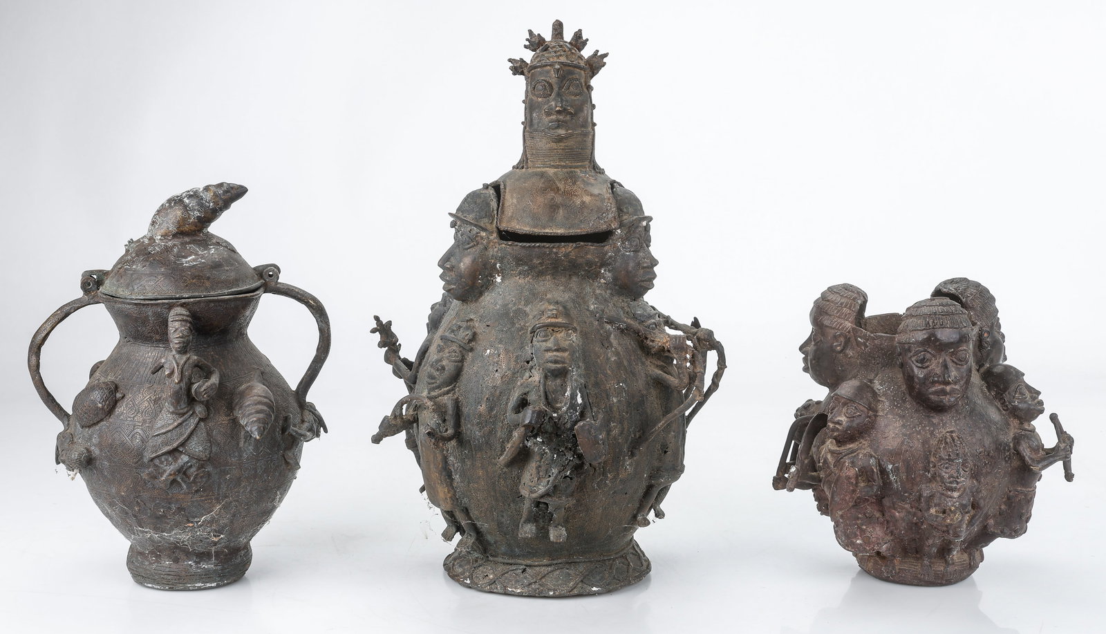 Group Of 3 Benin Bronze Vessels, H: 12"-24": Group Of 3 Benin Bronze Vessels, One Lacking Lid. Sizes From: 12'' x 9'' x 11'' (30 x 23 x 28 cm); To: 24'' x 15'' x 15'' (61 x 38 x 38 cm). Total weight: 63 lbs. Provenance: Collection of Charles L.