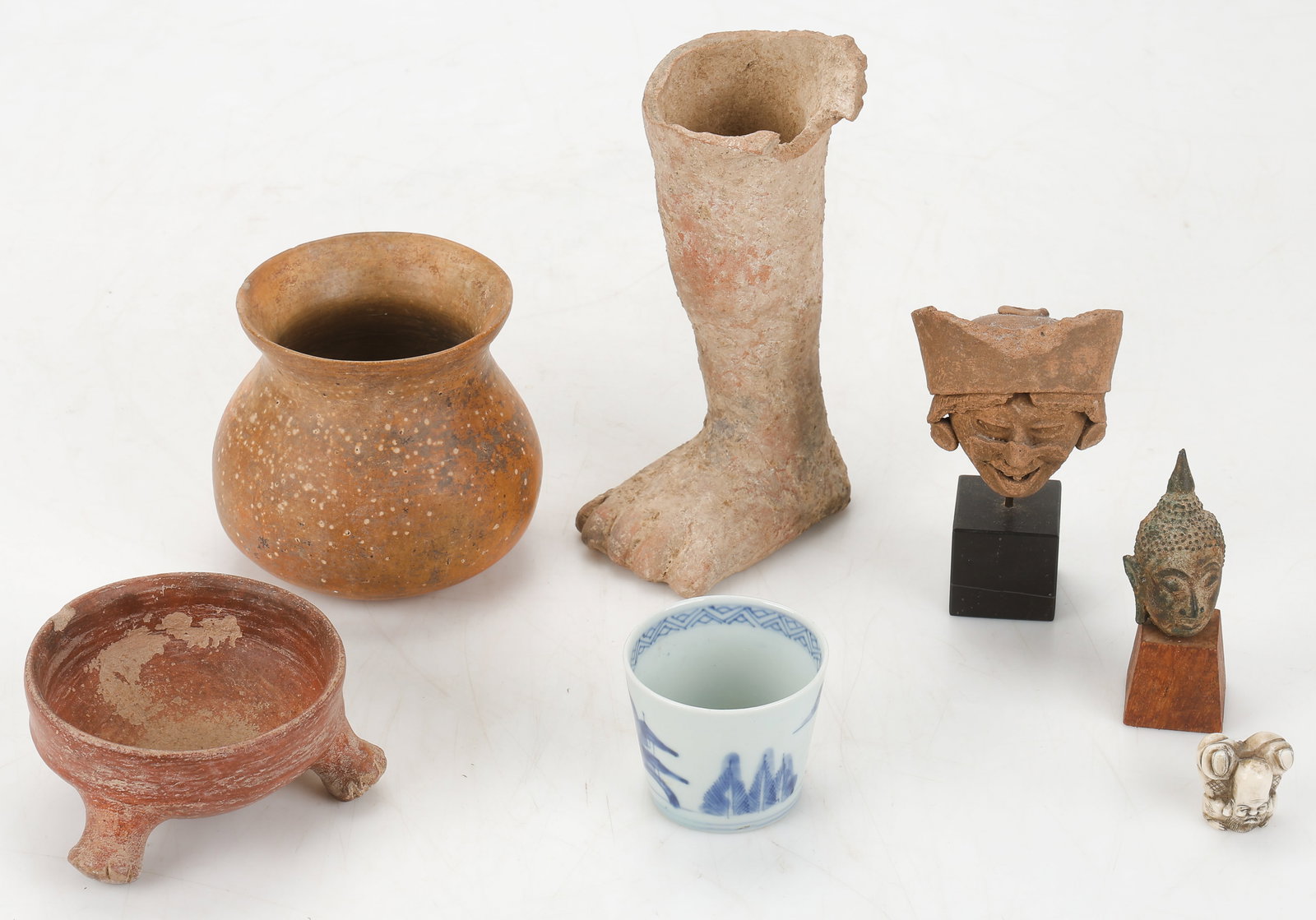 Ethnographic Collector's Lot (7 Pieces) Various Cultures: Ethnographic Collector's Lot (7 Pieces). 1) Unglazed ceramic Pre-Columbian jar, possibly Nayarit or Gran Chiriqui. 2) Redware ceramic Pre-Columbian tripod bowl. 3) Small carved bone Japanese netsuke,