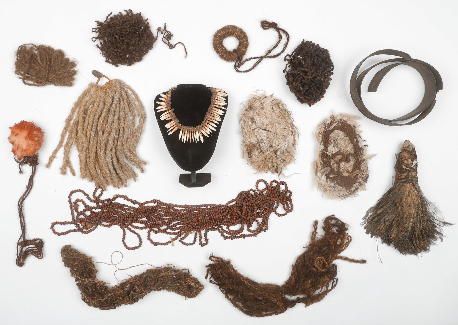 Ethnographic Collector's Lot (14 Pieces), Oceanic: Ethnographic Collector's Lot (14 Pieces), Oceanic. Including Aboriginal Australian hair artifacts, along with a bark belt from Papua New Guinea, a long string of Aboriginal seed beads used in traditio