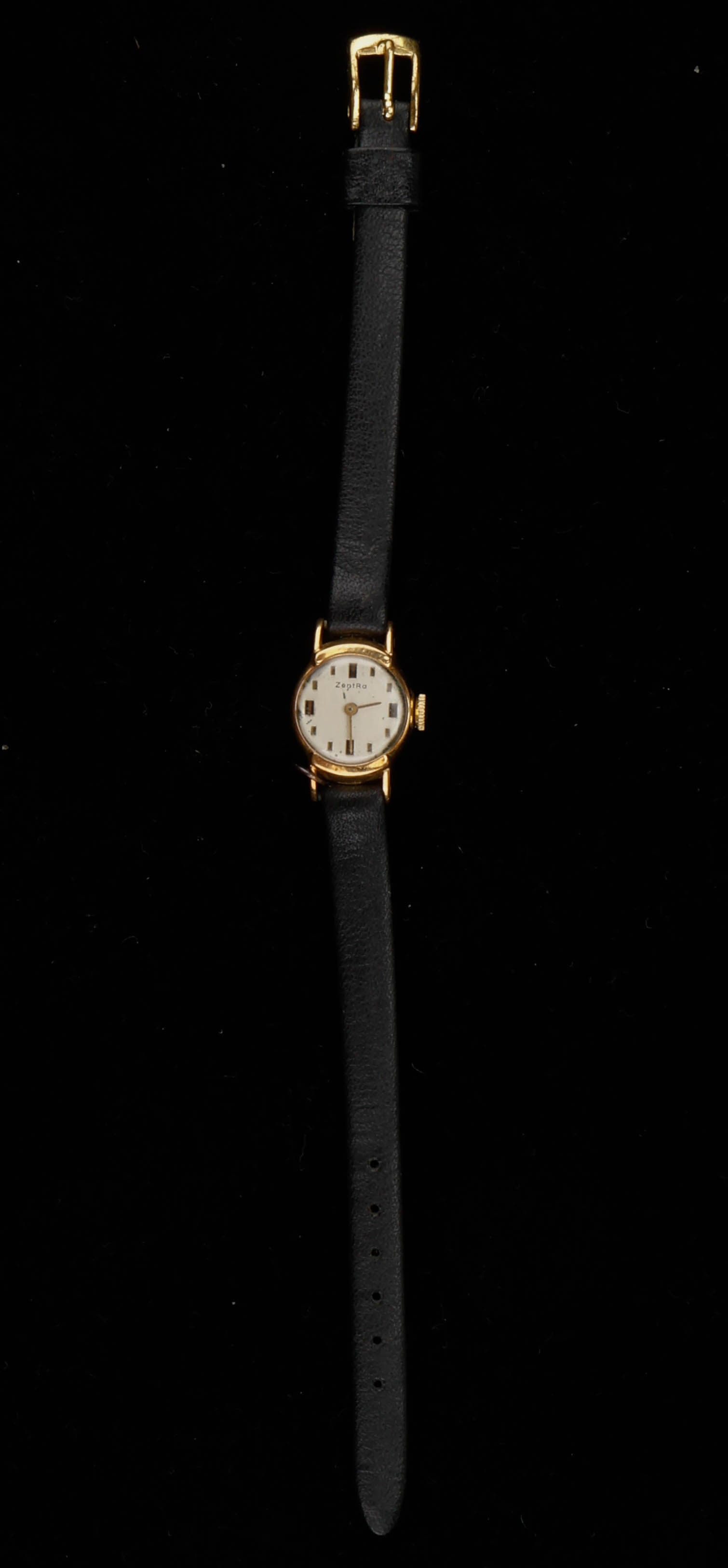 Vintage 18K Gold Zentra Ladies Wristwatch: Vintage 18K Gold Zentra Ladies Wristwatch. Back of case marked: 18K 0.750 1315 7 / 18854 / 50. Leather band. Length: 8" (20 cm). Approximate pennyweight 3.7 with out strap.