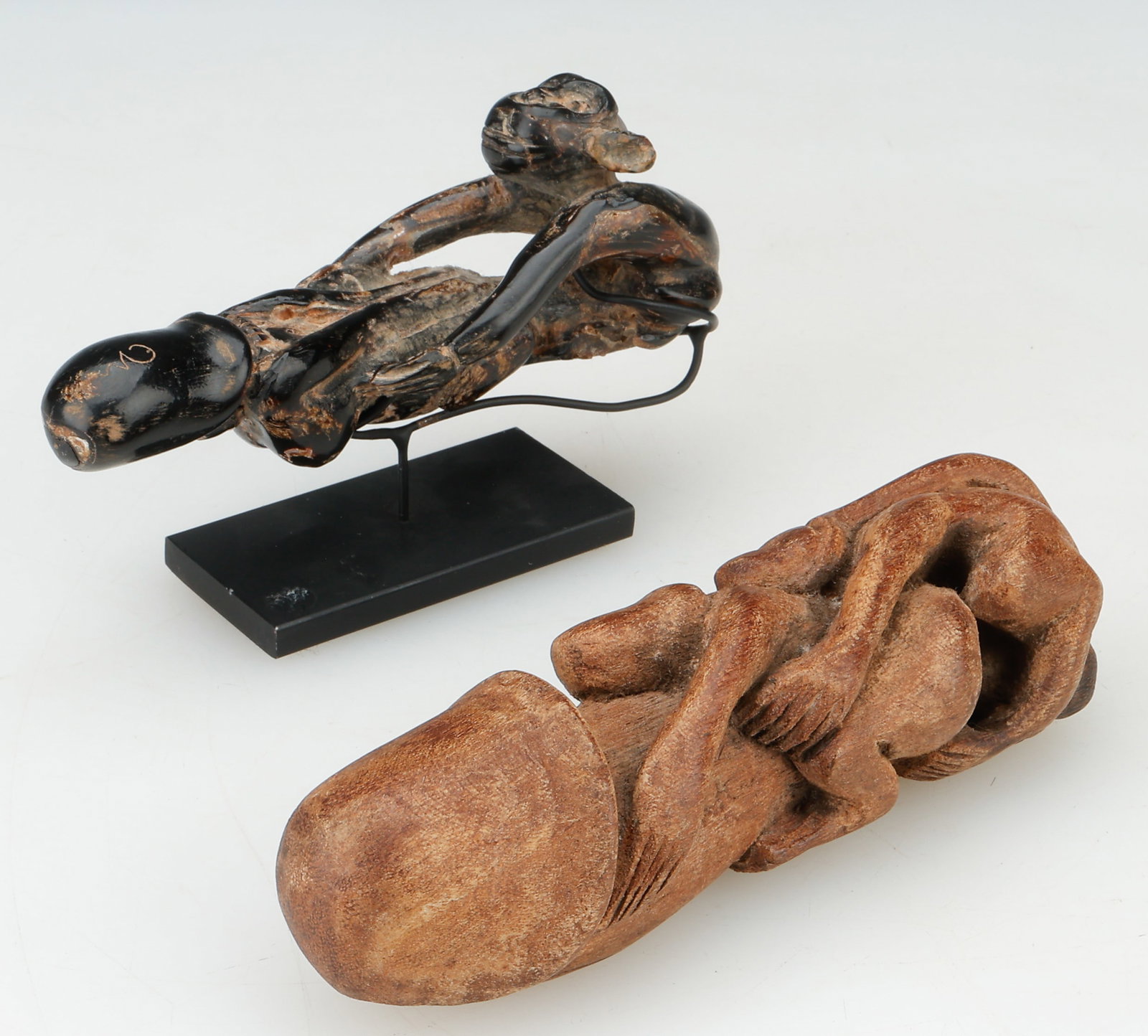 2 Thai Coral And Wood Palad Khik Phallic Amulets, C. 1950s, L: 5"; 5.5": 2 Thai Coral And Wood Palad Khik Phallic Amulets, C. 1950s. Sizes: 1) 2'' x 5'' x 1.5'' (5 x 13 x 4 cm). Hos: 3" (8 cm); 2) 1.5'' x 5.5'' x 1.5'' (4 x 14 x 4 cm). One of carved wood, and one (on a met