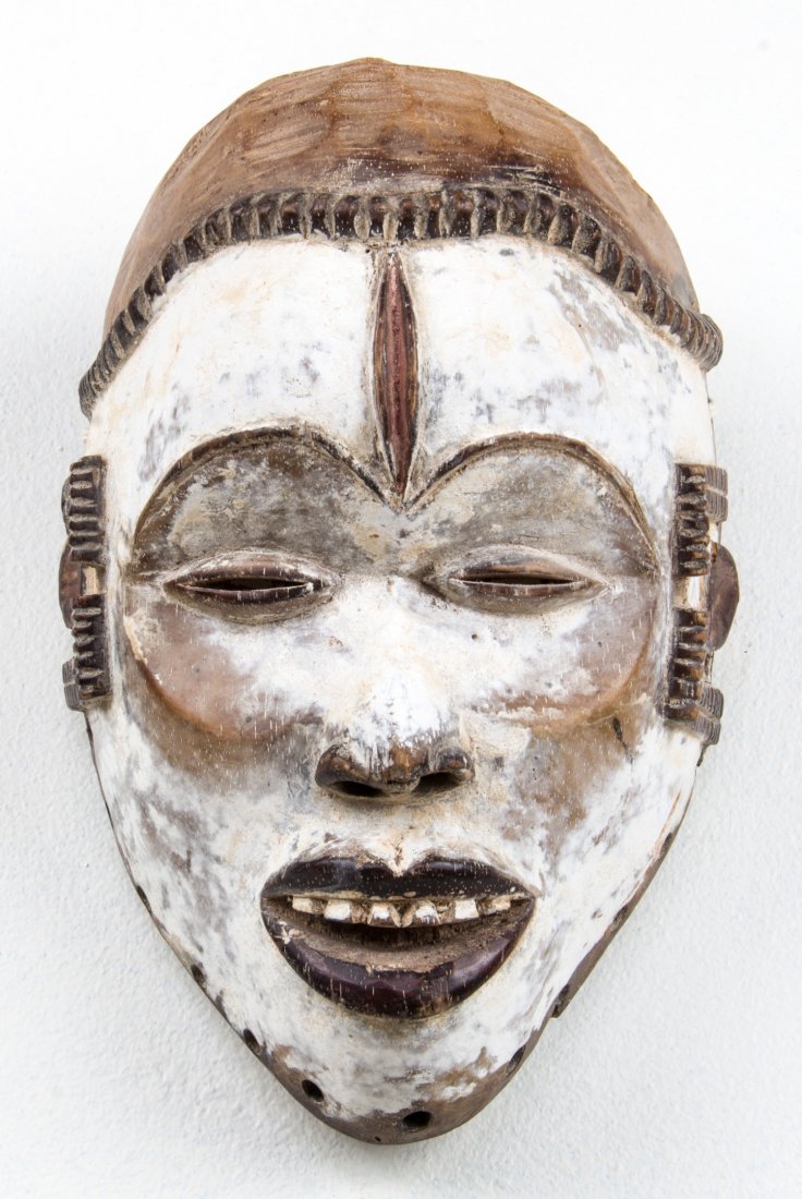 African Kongo Mask: African Kongo Mask. Carved wood, kaolin. Size: 11" x 7" x 5". Provenance: Max Garb, Chicago, Illinois.