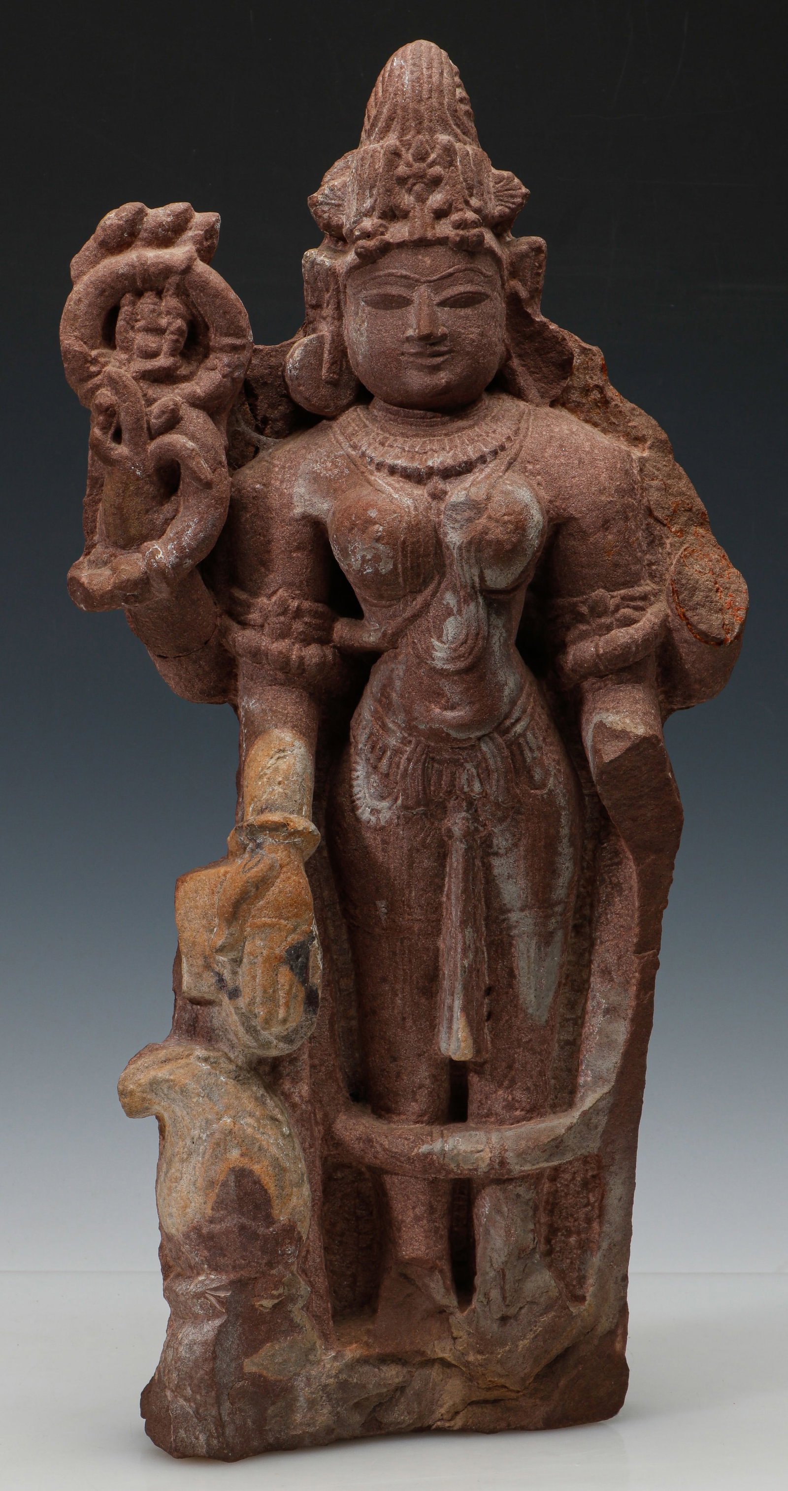 Indian Sandstone Figure of a Goddess, Probably Devi or Parvati, Northern or Central India, 10th-12th: Indian Sandstone Figure of a Goddess, Probably Devi or Parvati, Northern or Central India, 10th-12th C. Finely carved standing female divinity likely representing a form of Devi, possibly Parvati, ren
