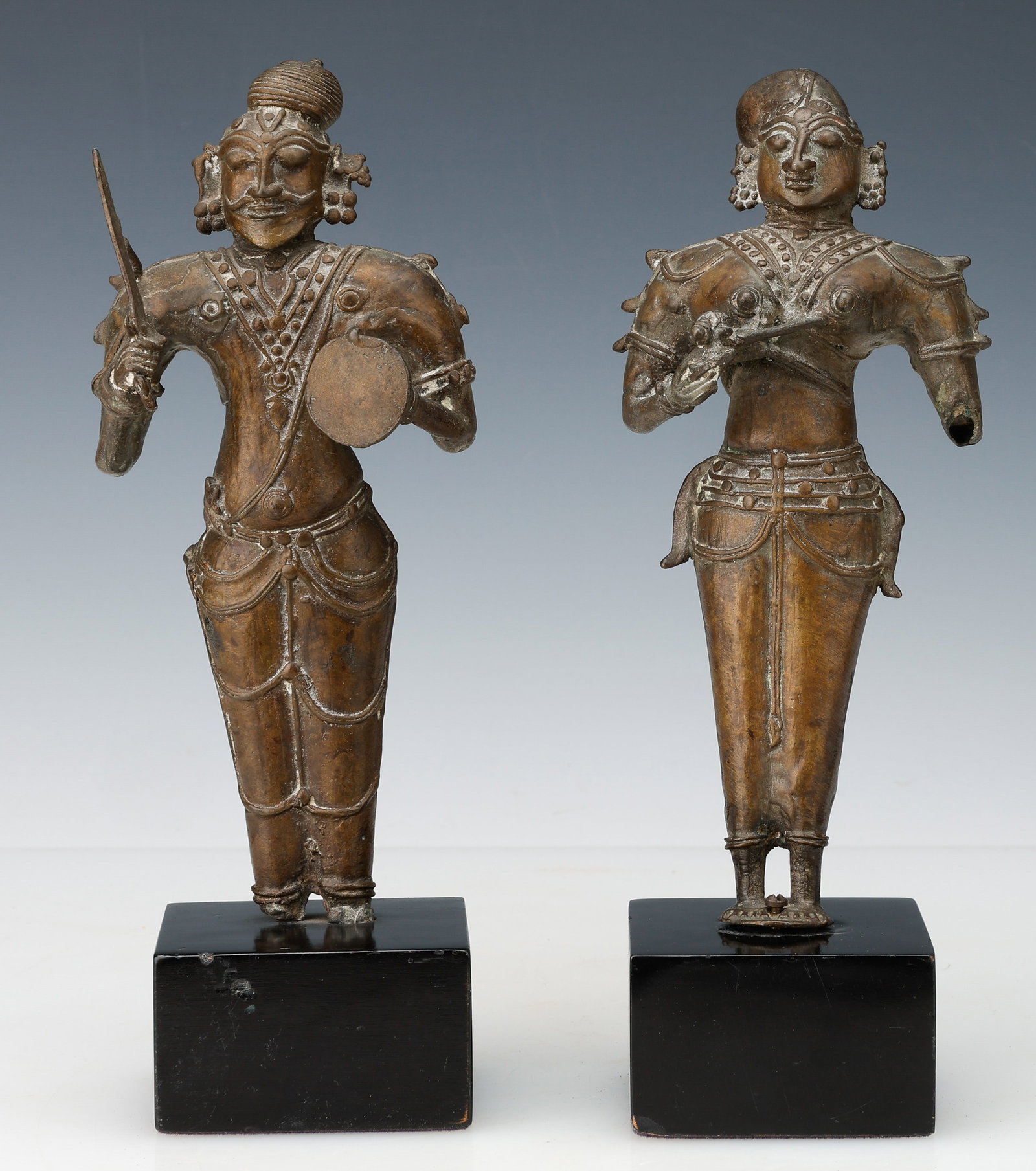 Pair Of Indian Bronzes, South India (Tamil Nadu, Pandyan) 16th-18th C.: Pair Of Indian Bronzes, South India (Tamil Nadu, Pandyan) 16th-18th C. Folk bronze tradition. Cast and formed by hand. Each Size: 9'' x 4'' x 2.5'' (23 x 10 x 6 cm); Hos: 10.5" (27 cm). Provenance: Pu