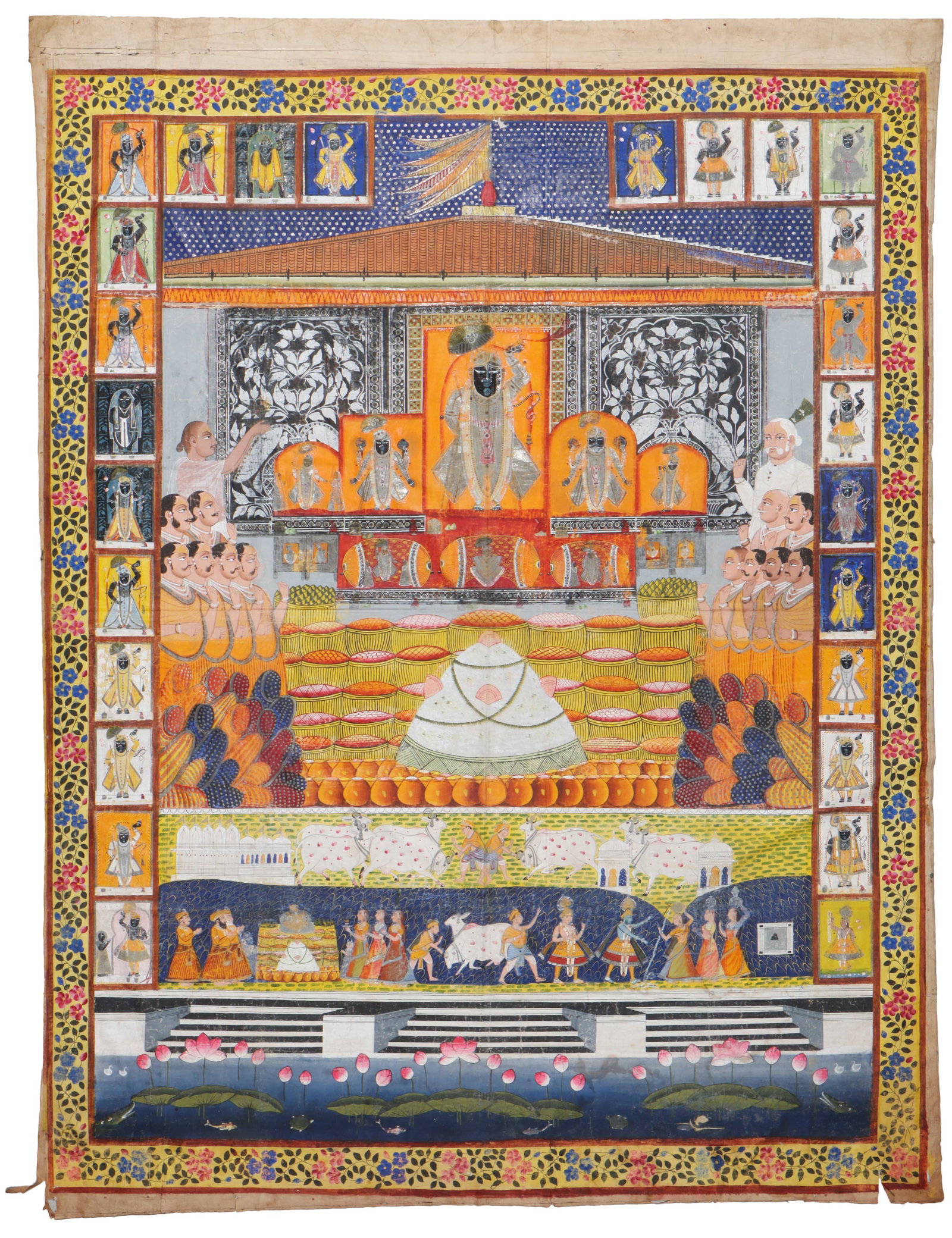 Monumental Antique Nathdwara Pichvai Of Shrinathji Annakut Darshan, 8'7" x 6'8": Monumental Antique Nathdwara Pichvai Of Shrinathji Annakut Darshan, Size: 8'7'' x 6'8'' (262 x 203 cm). A monumental Nathdwara school pichhvai depicting Shrinathji (Krishna as Govardhan-lifter) in Ann