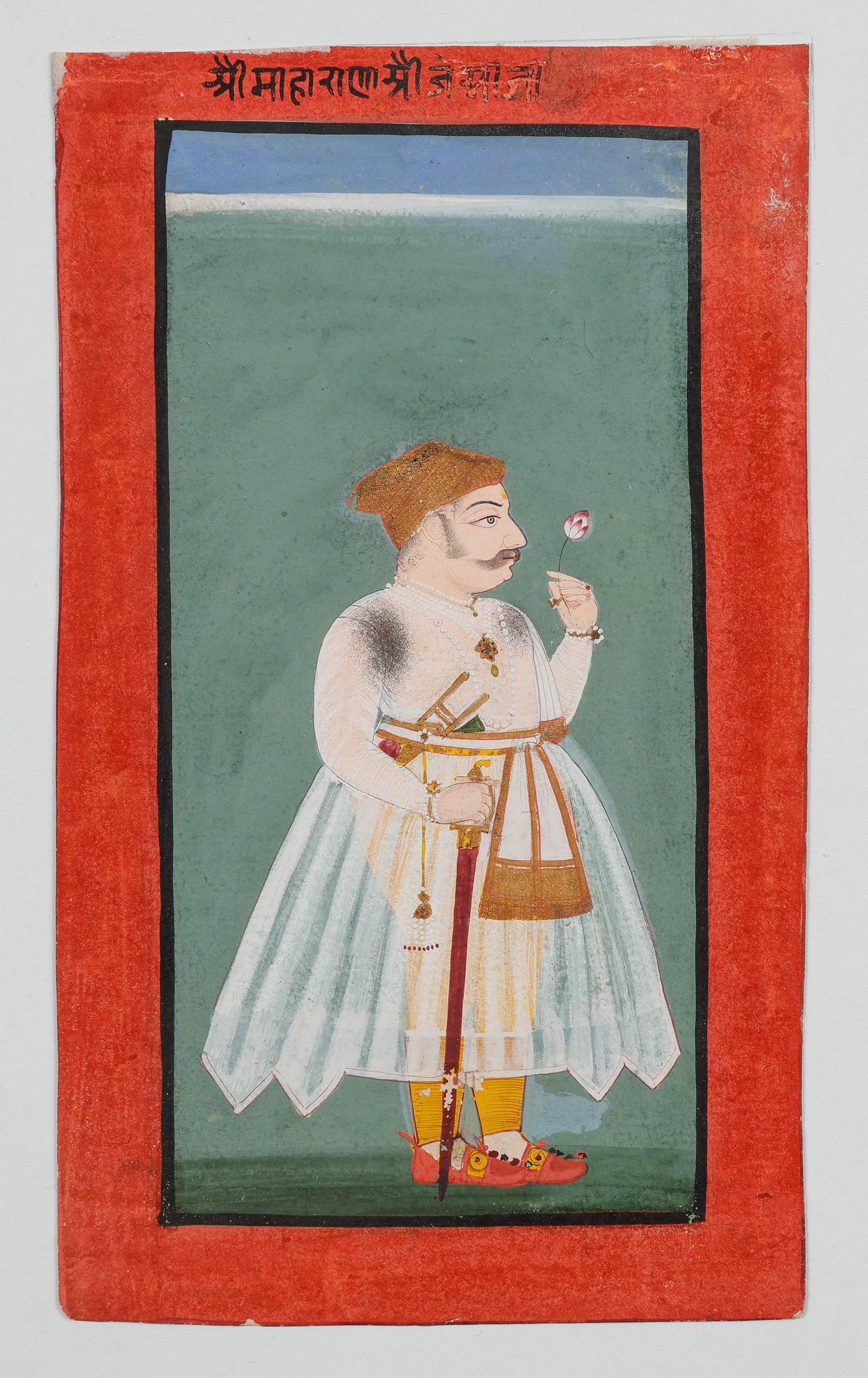 Rajasthani School Portrait Of A Maharana Jai Singh Of Mewar, Late 18th C.: Rajasthani School Portrait Of A Maharana Jai Singh Of Mewar, Late 18th C. Size: 9.5'' x 5.5'', 24 x 14 cm (sheet); 14'' x 11'', 36 x 28 cm (mat). Opaque watercolor and gold on paper depicting a standi