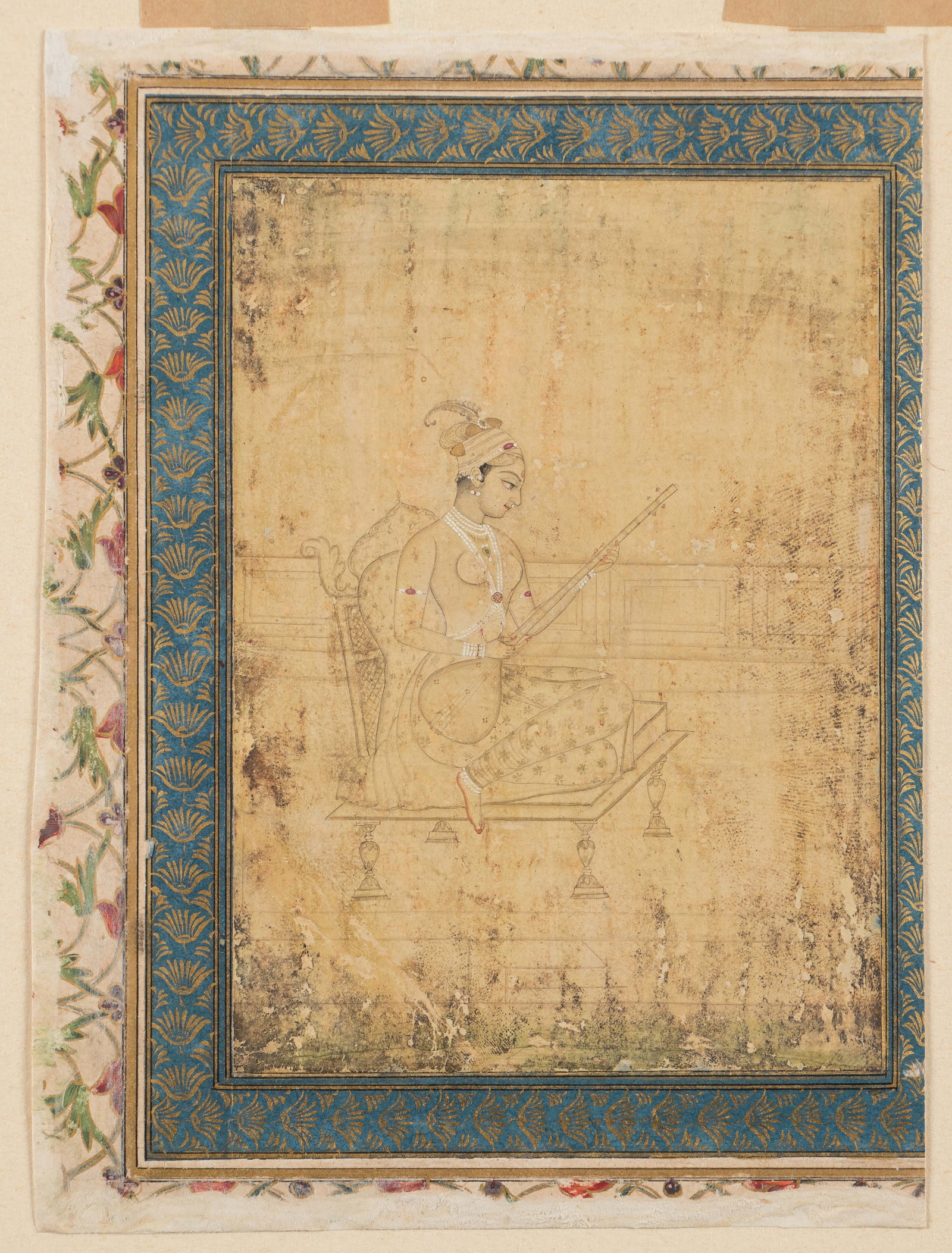 Mughal Miniature Painting Of A Princess Playing Tanpura, Early 18th C.: Mughal Miniature Painting Of A Princess Playing Tanpura, Early 18th C. Opaque watercolor and gold on paper. A princess seated on a gilt-edged throne on a terrace playing a tambura. She is bare breaste