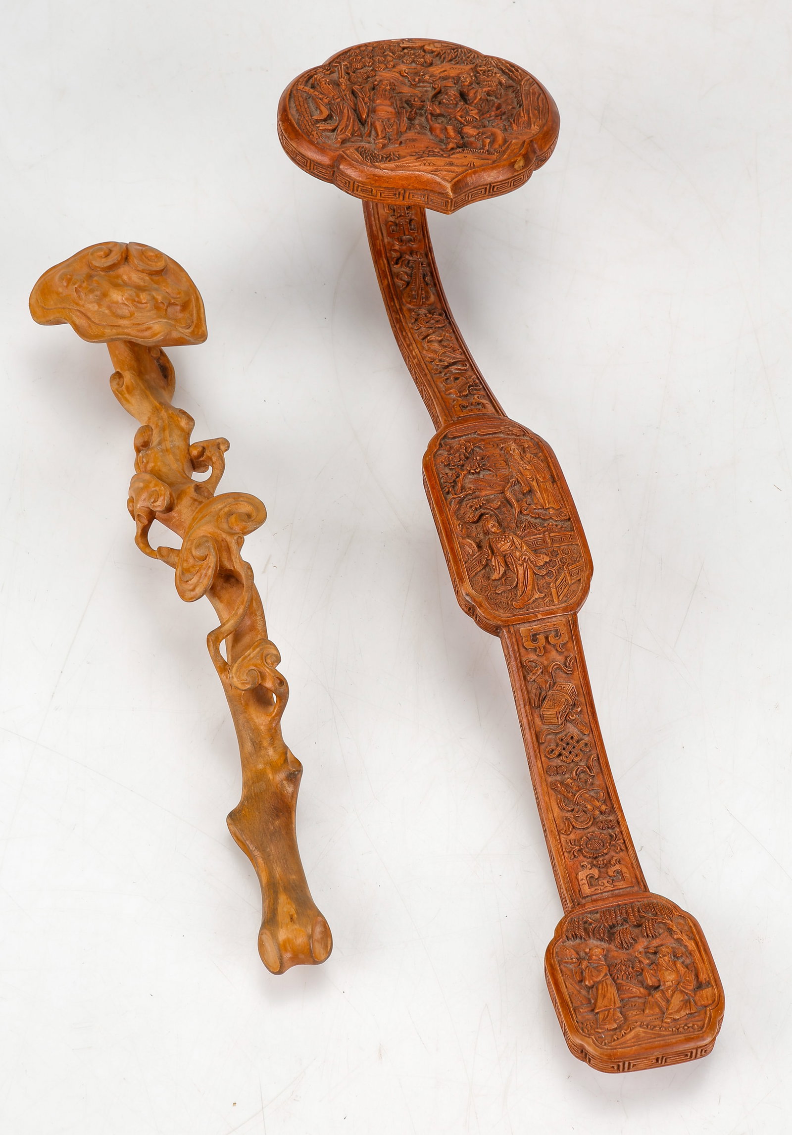 2 Carved Wood Ruyi Scepters, Qing Dynasty-Republic Period, Late 19th-Early 20th Century: 2 Carved Wood Ruyi Scepters, Qing Dynasty-Republic Period, Late 19th-Early 20th Century. The larger featuring deeply carved figural reserves depicting courtly or immortal scenes amid landscape setting