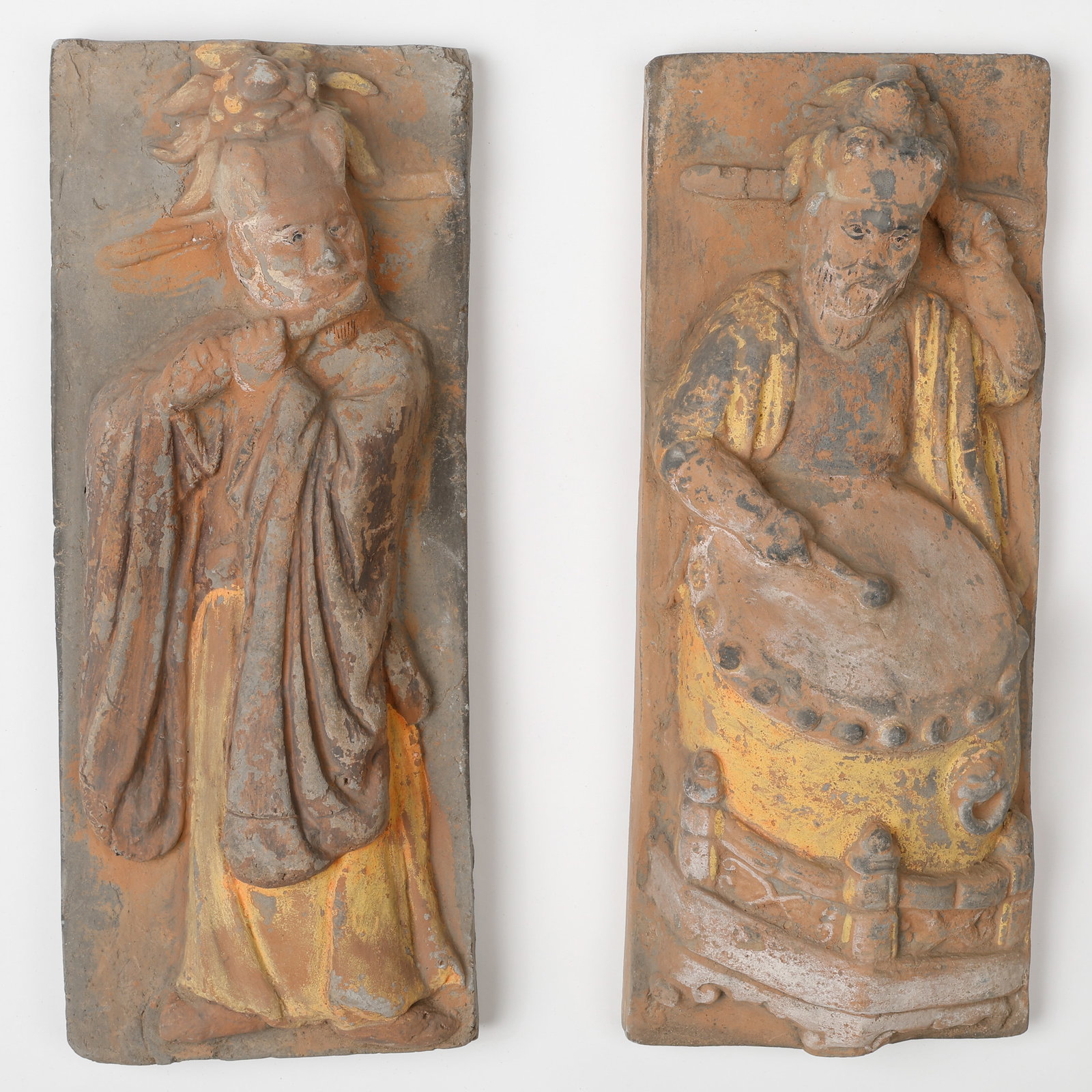 Very Rare Pair of Chinese Terracotta Architectural Reliefs, Possibly Tang-Song Dynasty: Very Rare Pair of Chinese Terracotta Architectural Reliefs, Possibly Tang-Song Dynasty. Modeled in high relief and depicting robed figures, one beside a ceremonial drum, retaining traces of pigment an
