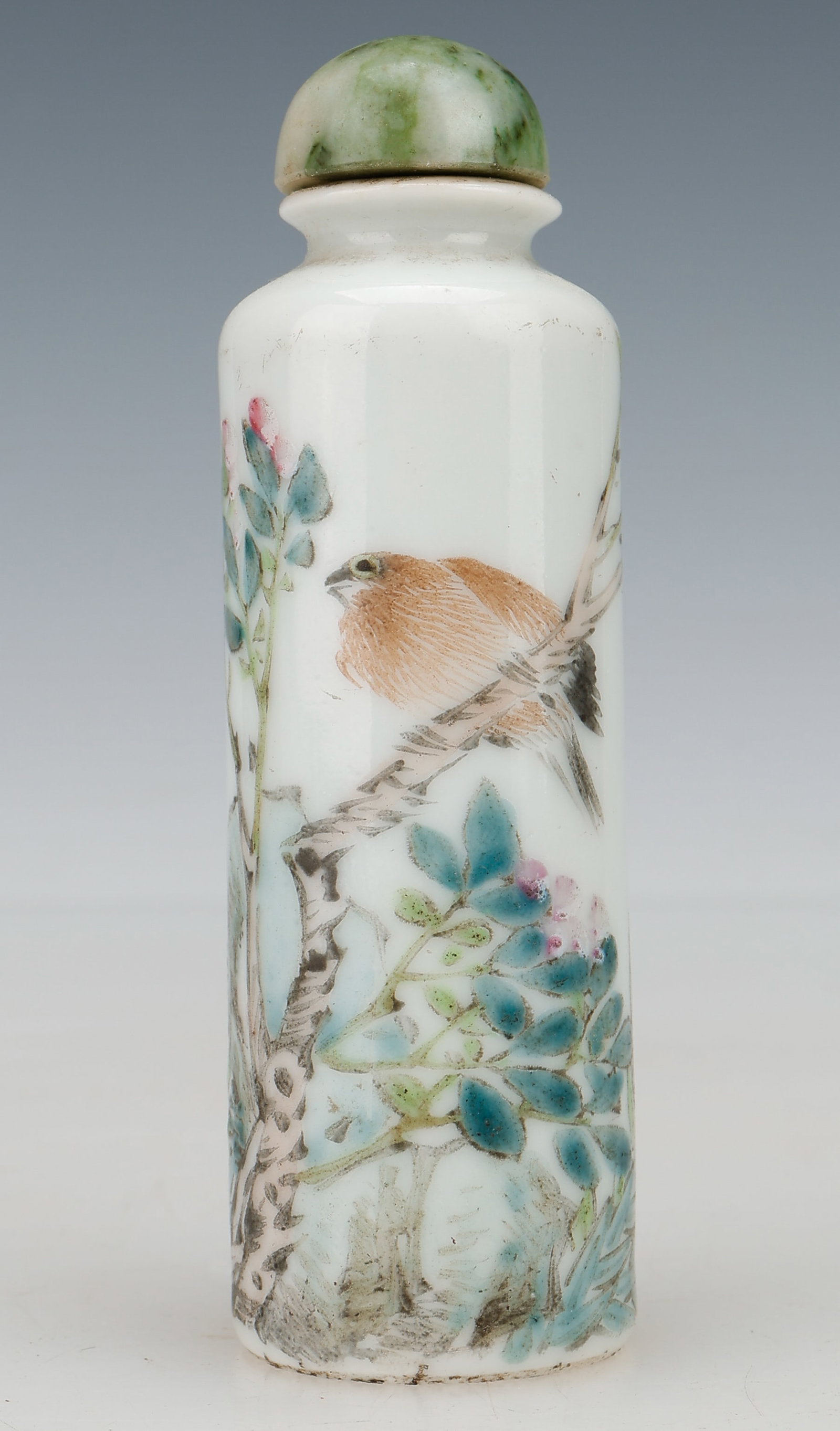 Chinese Polychrome Porcelain Cylindrical Snuff Bottle With Green Stone Stopper, Republic Period, by: Chinese Polychrome Porcelain Cylindrical Snuff Bottle With Green Stone Stopper, Republic Period, by Xu Changheng. Painted with bird on branch. Size: 3'' x 1'' x 1'' (8 x 3 x 3 cm). Provenance: Estate 