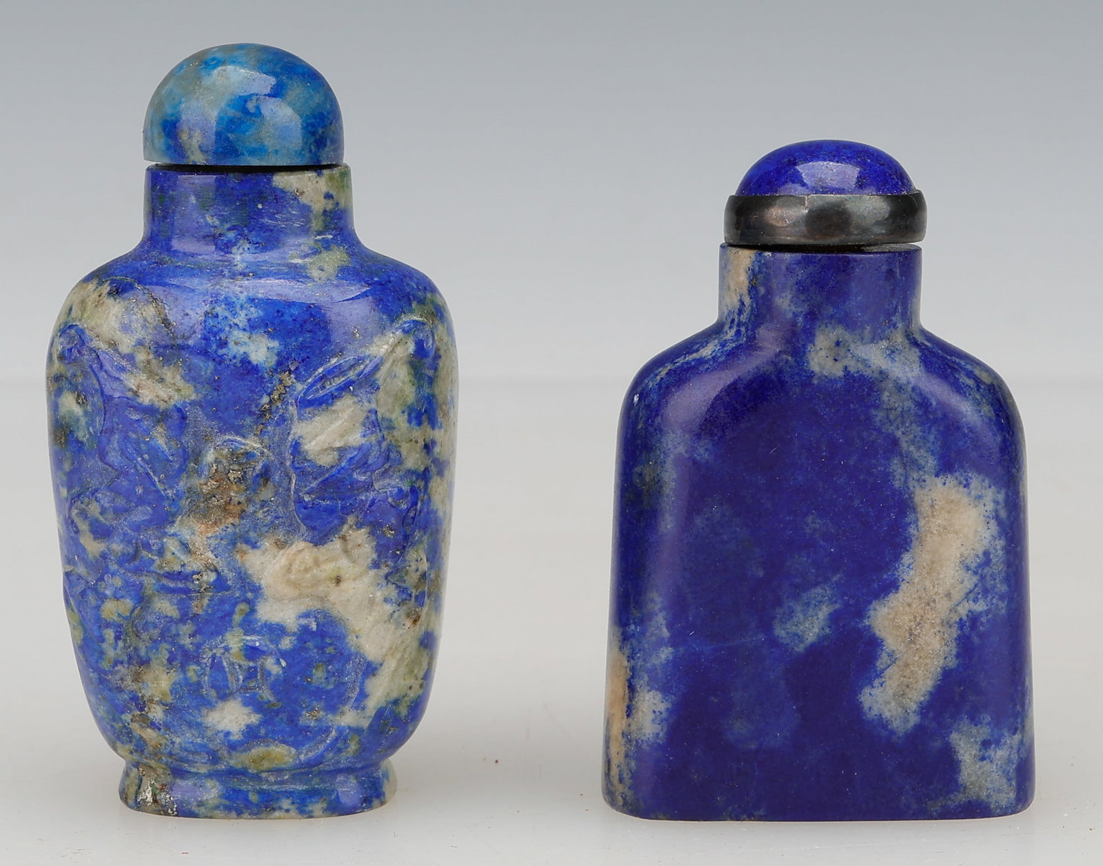 2 Chinese Lapis Lazuli Snuff Bottles: 2 Chinese Lapis Lazuli Snuff Bottles. Sizes: 1) 2'' x 1.5'' x .5'' (5 x 4 x 1 cm); 2) 2.5'' x 1'' x 1'' (6 x 3 x 3 cm). Provenance: Estate of Elizabeth G. Peek, Pasadena, CA.