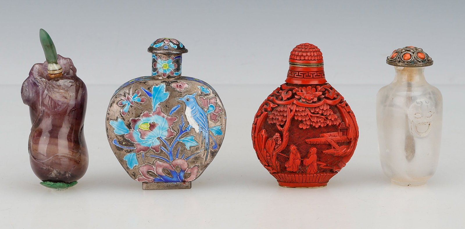 4 Chinese Snuff Bottles, Late 19th C.: 4 Chinese Snuff Bottles. Including: 1) an amethyst gourd-form bottle with green jadeite stopper. 2) enamel on silver heart-form bottle, c.1900, foliage, bird and branch decoration. 3) Cinnabar style b