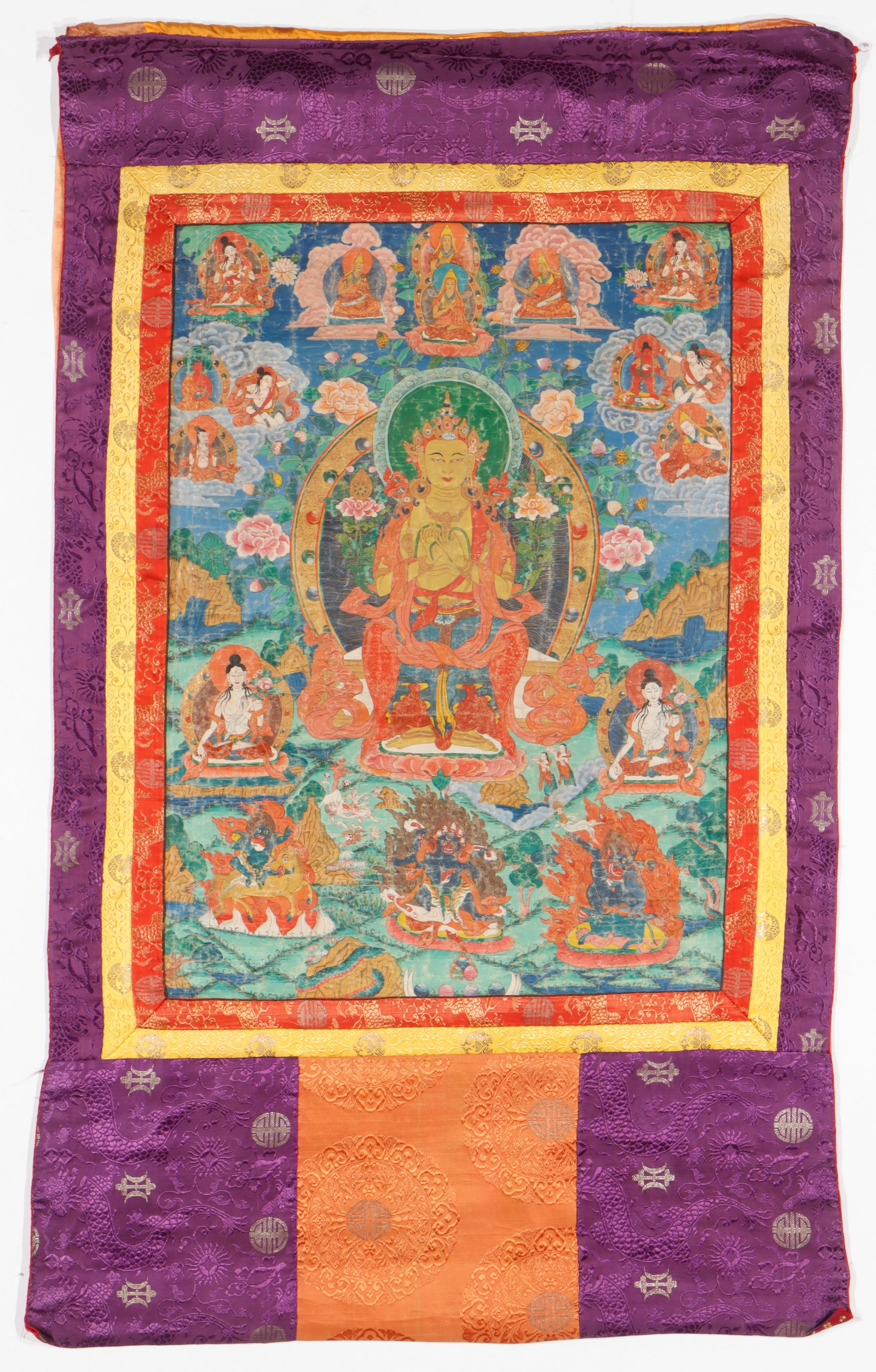 Antique Tibetan Maitreya Buddha Thangka: Antique Tibetan Maitreya Buddha Thangka. Painting on cloth, purple silk brocade borders. Size: 32'' x 23'', 81 x 58 cm (image); 54'' x 34'', 137 x 86 cm (overall).