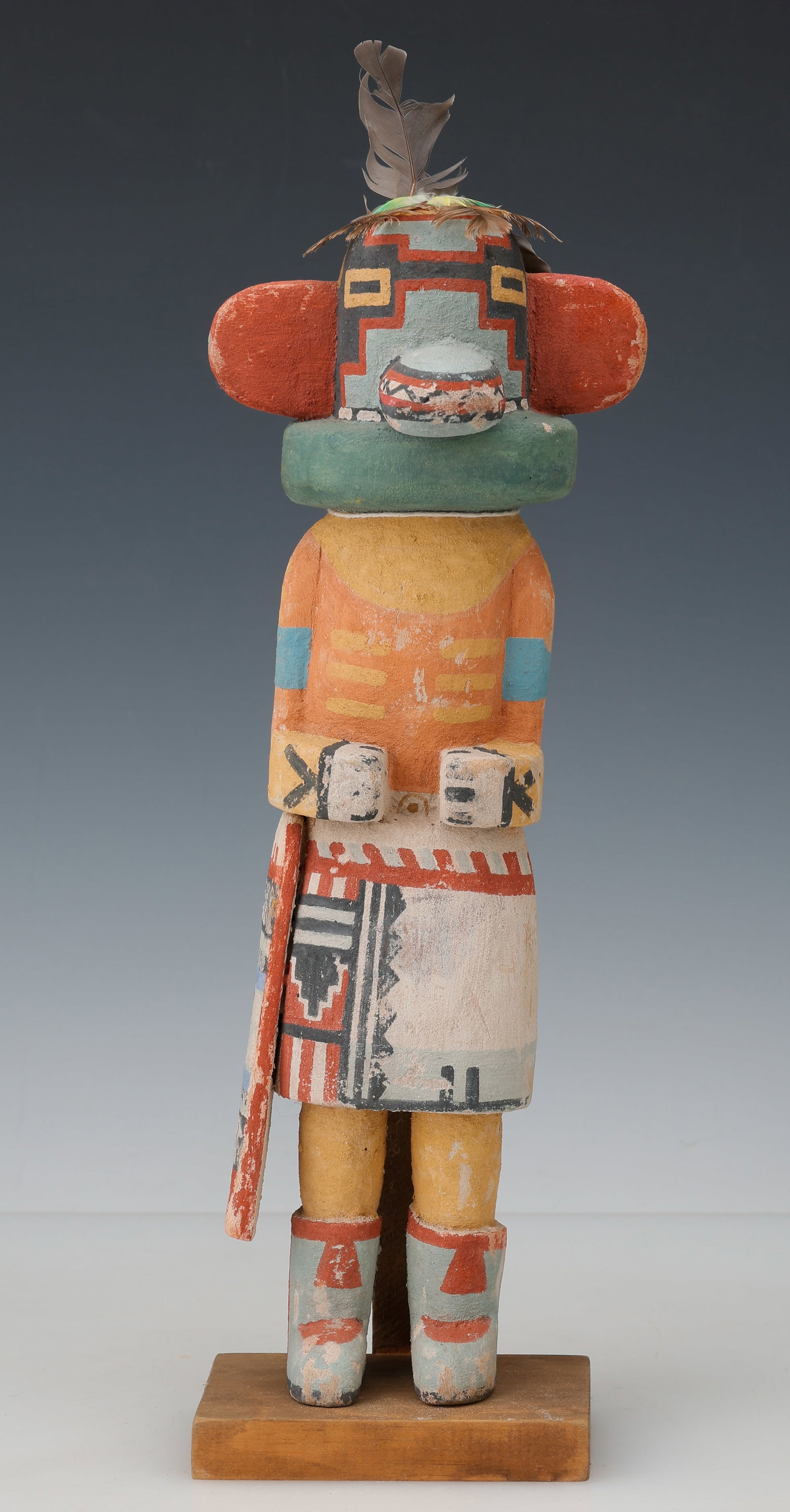 Vintage Hopi Hemis Kachina, Mid-20th C. H:12": Vintage Hopi Hemis Kachina, Mid-20th C. A vintage Carved wood, pigment, feathers. Shown standing with painted kilt, geometric ceremonial motifs, and stylized mask with stepped cloud decoration and cyl