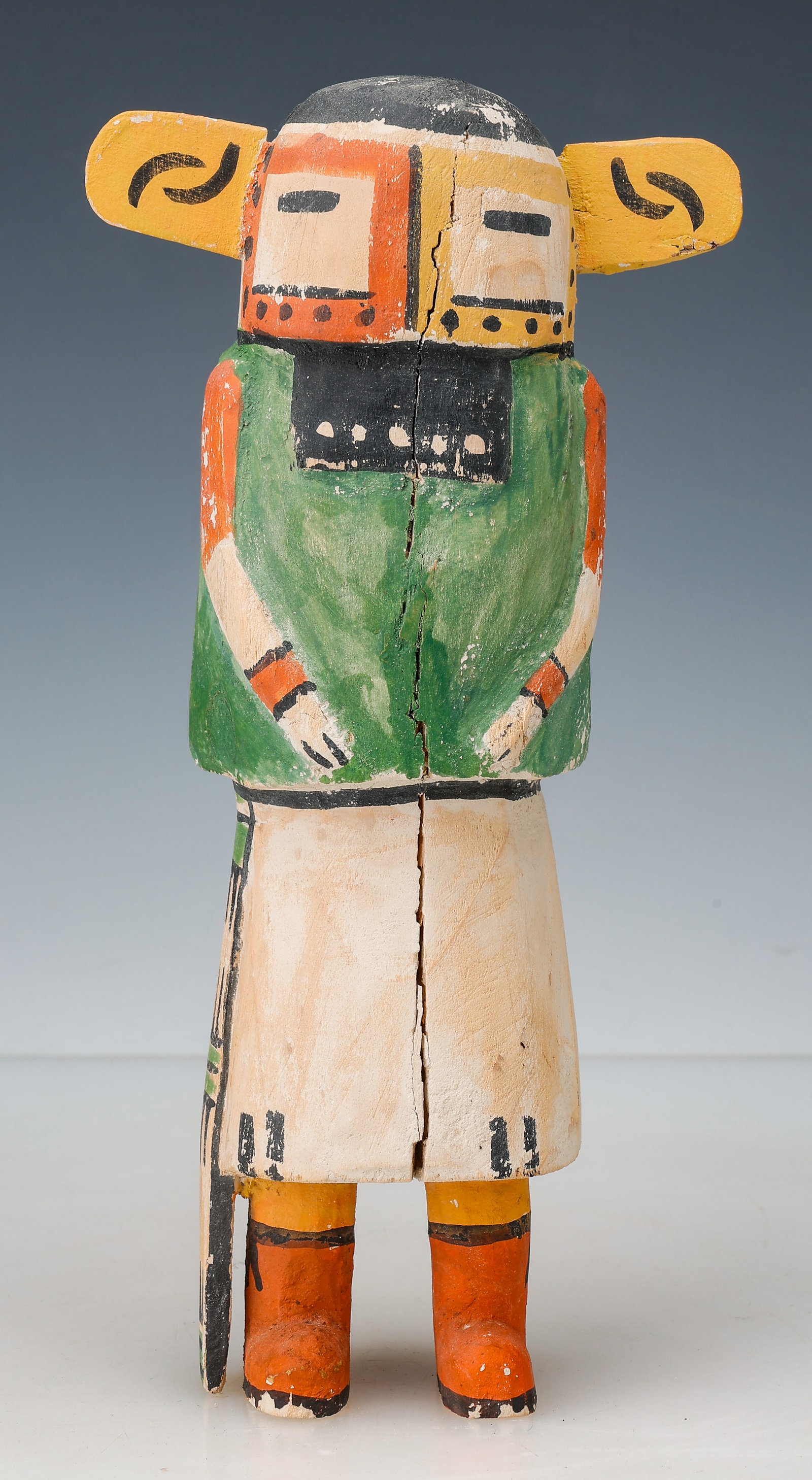 Hopi Nakwach Katsina Polychrome Cottonwood Doll, H:11": A carved and painted Hopi katsina doll (kachina) depicting a Nakwach-related katsina figure, Hopi Pueblo, Arizona, mid-20th century. The figure features a stylized mask face with slit eyes, black mout