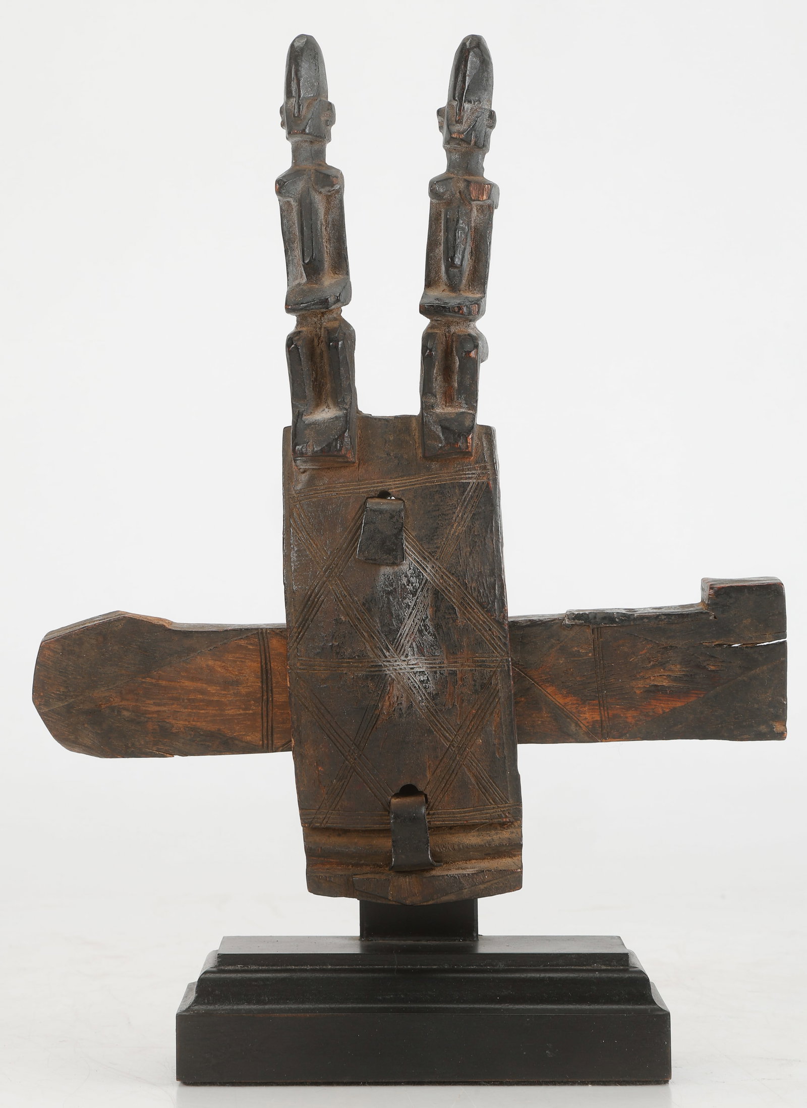 Dogon Granary Lock With 2 Ancestor Figures, Mali, H: 11": Dogon Granary Lock With 2 Ancestor Figures, Mali. Carved wood with metal fittings. Complete with key. On stand. Size: 11'' x 10'' x 1.5'' (28 x 25 x 4 cm); Height on Stand: 13'' (33 cm).