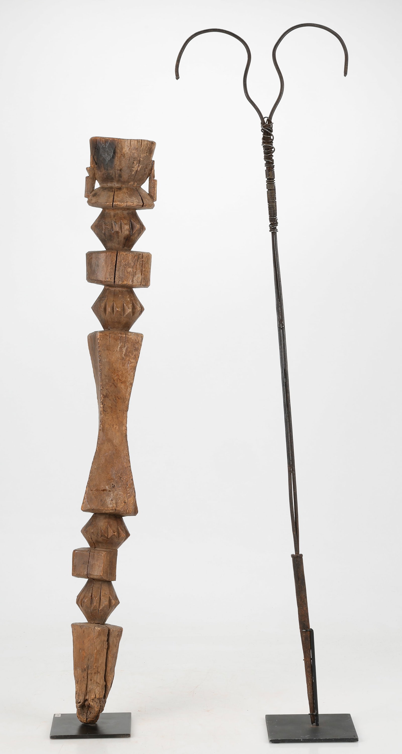Ethiopian Pilgrim's Walking Stick, Late 19th-Early20th C. And Nupe Post, H: 41", 48": Ethiopian Pilgrim's Walking Stick, Late 19th-Early 20th C. Together with a Nupe Shrine Post. Max. Height: 41" (104 cm); 48" (122) cm). Provenance: Douglas Dawson Gallery, Chicago, IL.