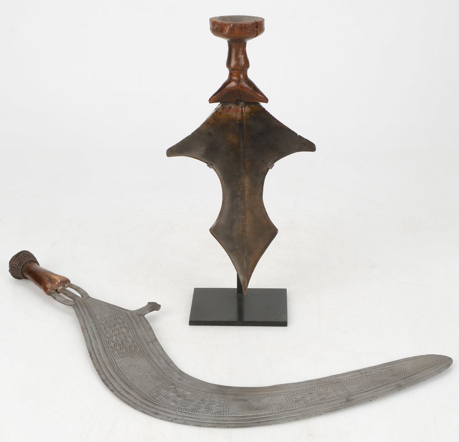 Two Congo Knives: Two Congo Knives. Tetela, mounted; and a fine Nbenga, Boa, Bandia, Yakoma, Nsakara sword. Sizes: 1) 11'' x 6'' x .5'' (28 x 15 x 1 cm); 2) 19'' x 10'' x .5'' (48 x 25 x 1 cm). Provenance: ex Collectio