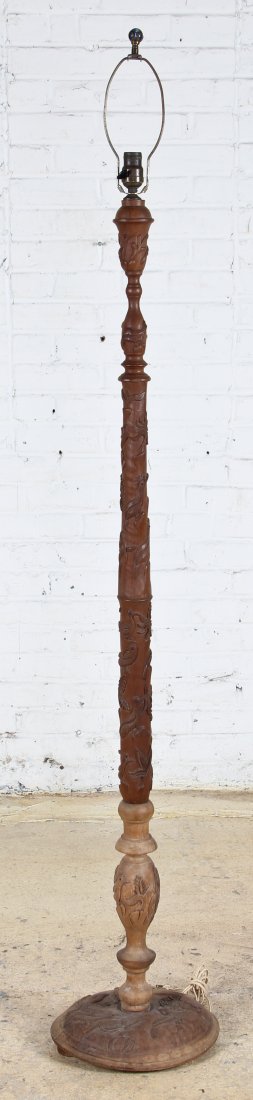 Relief Carved Asian Folk Art Floor Lamp: Relief Carved Asian Folk Art Floor Lamp. Aviary motif featuring birds with inset garnet eyes. Monogrammed and numbered in pencil on base. Size: 72" x 13" x 11.5".