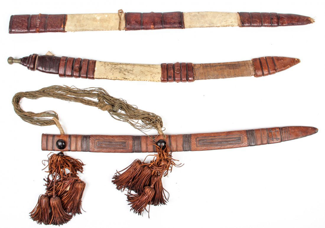 Lot of 3 North African Leather Sheaths + 1 Sword: Lot of 3 North African Leather Sheaths, 1 including Sword. Size: 32" x 2.5" x .75" (each).