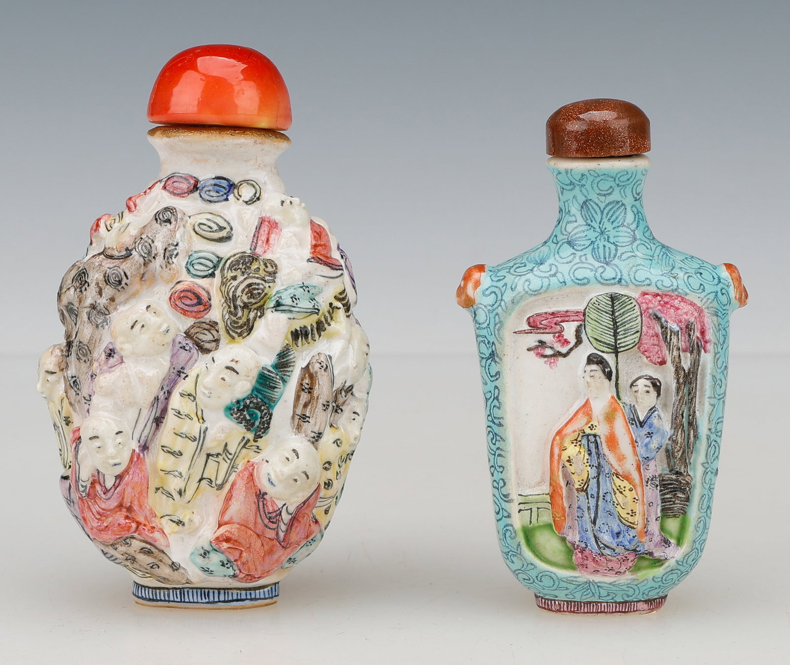 2 Chinese Export Porcelain Snuff Bottles, Late Qing Dynasty to Republic Period: 2 Chinese Export Porcelain Snuff Bottles, Late Qing Dynasty to Republic Period. Including: 1) Chinese porcelain high relief molded decoration and famille rose enamels, orange porcelain stopper, early 
