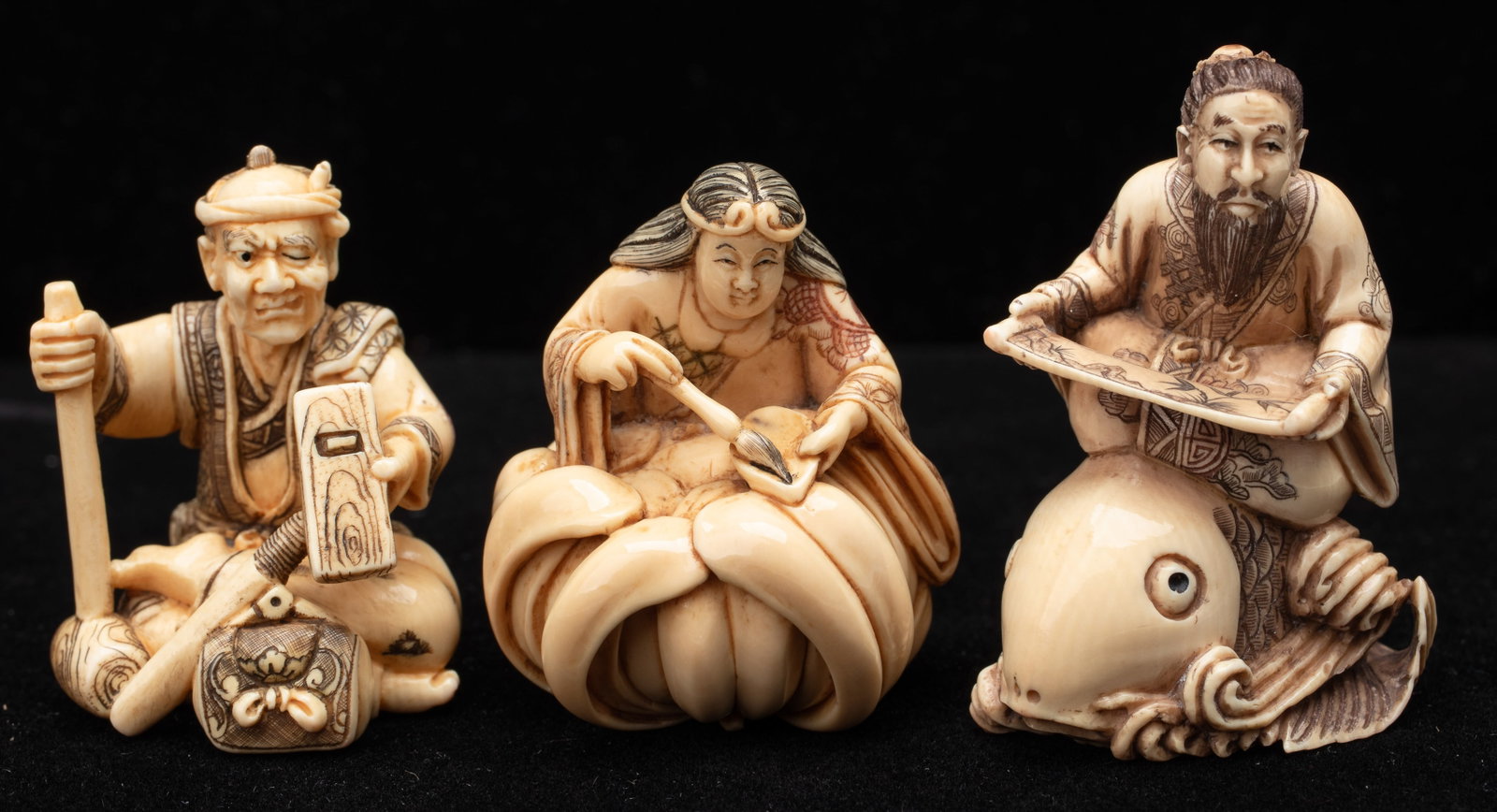 3 Antique Signed Japanese Netsukes: 3 Antique Signed Japanese Netsukes. Including a woman with ink brush seated on a lotus, a bearded figure seated on a a carp (koi) admiring a hand scroll, and a carpenter with tools. Heights From: 1.5"