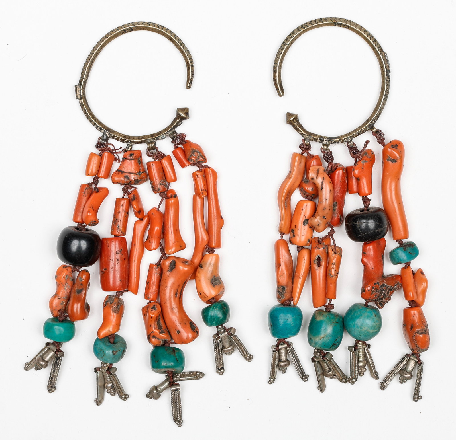 Antique Moroccan Berber Coral and Turquoise Earrings: Antique Moroccan Berber earrings with coral and turquoise. Each Length: 8" (20 cm). Total weight: 288 grams. Provenance: Ex. Artist Louise Nevelson's personal collection; by family descent.