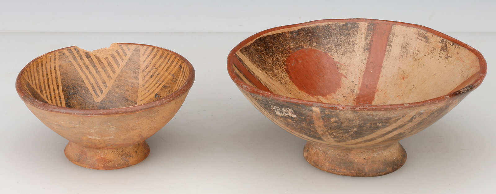 2 Narino Polychrome Pottery Pedestal Bowls: 2 Narino Polychrome Pottery Pedestal Bowls. Southwestern United States, probably Zuni Pueblo, New Mexico, late 19th/early 20th century. Sizes: 1) 2.5'' x 5.5'' x 5.5'' (6 x 14 x 14 cm); 2) 3.5'' x 8''