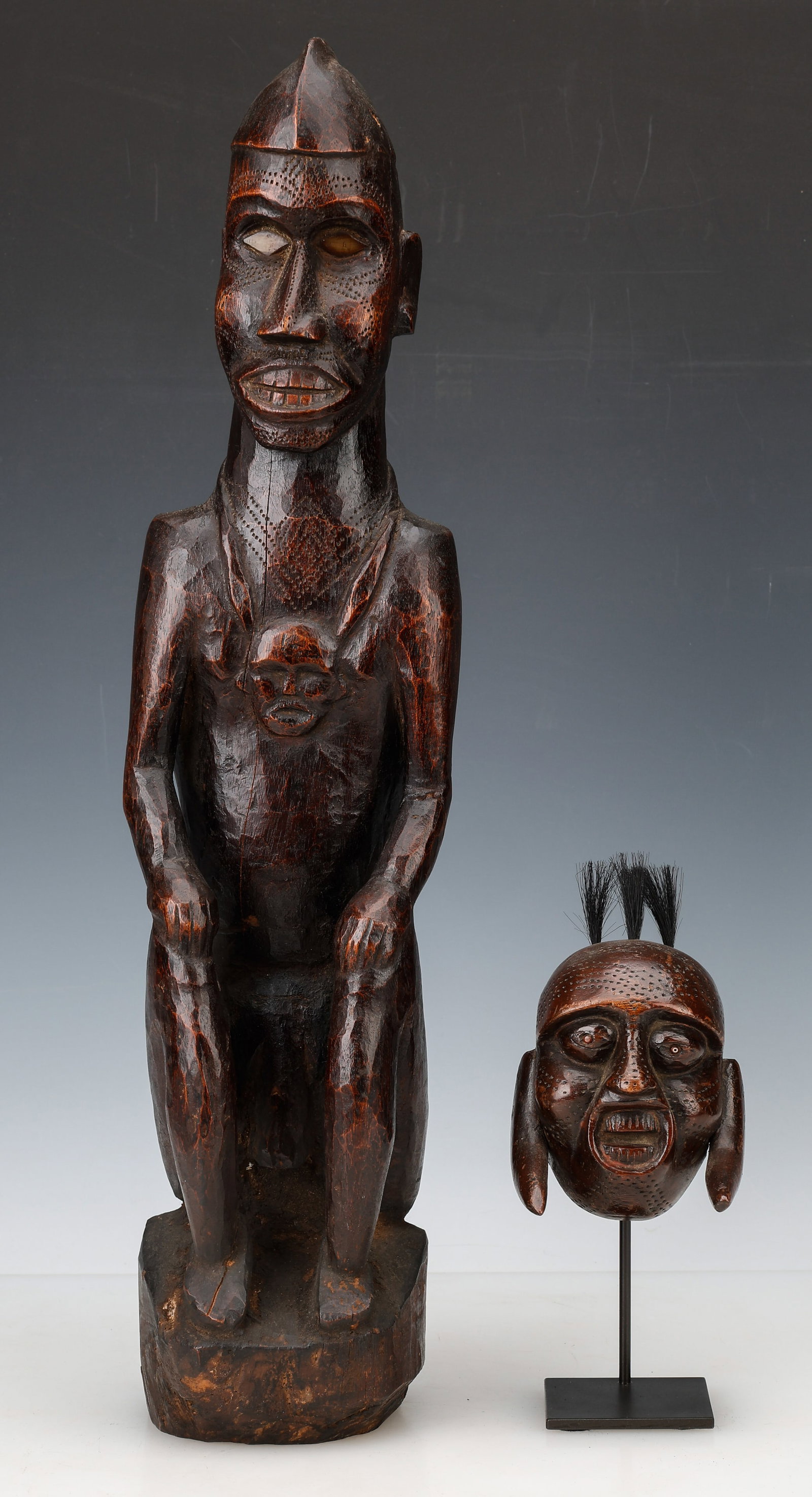 Large Figure and Head Pendant, Arunachal Pradesh: Large Figure and Head Pendant, Arunachal Pradesh. Carved wood; head pendant on stand. Arunachal Pradesh is located on the northeast frontier Tibetan/Burma hill area, renamed after Indian independence.