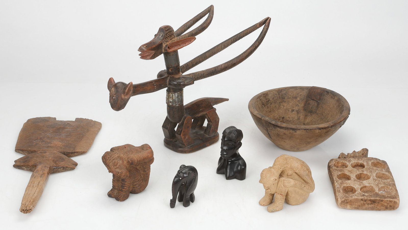 Collector's Lot of 8 Objects: Collector's Lot of 4 Malian Artefacts. Carved wood, pigments, and ceramics. Includes a 19th century Tuareg tent pole, two Djenne style clay figures, and a Bamana chiwara antelope headdress. Sizes From