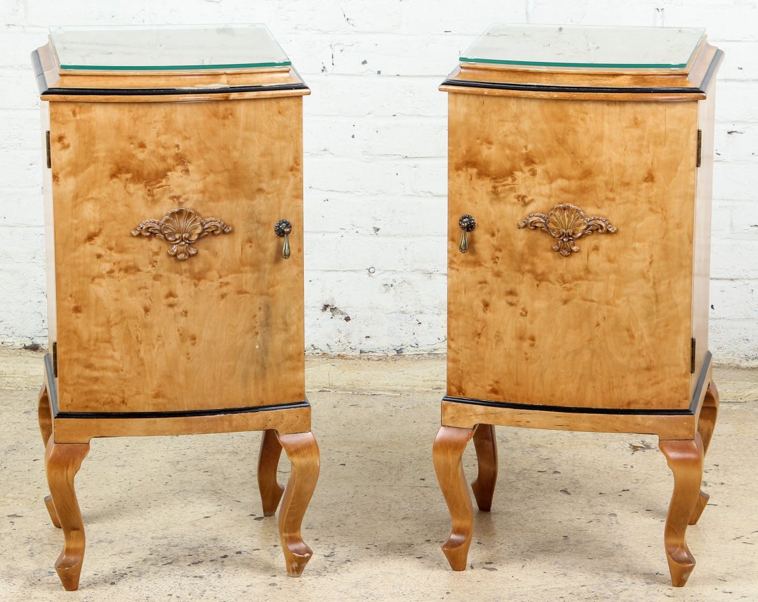 Biedermeier Style Birch and Ebonized Wood Stands: Biedermeier Style Birch and Ebonized Wood Stands. Hinged door fronts with applied shell carving. Glass tops. Size: 30" x 15.5" x 13.5" , 77 x 40 x 35 cm (each).