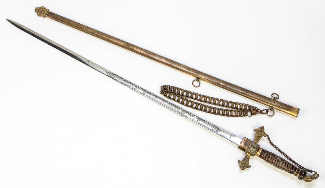 Knights Templar Raymold Whitlock Sword: Knights Templar Raymold Whitlock Sword. Incised scabbard and attached chain fob. Damascene etched blade marked "Manuel Viveiros" and "Raymold Whitlock, New York." Brass and leather handle. Size: 37" x
