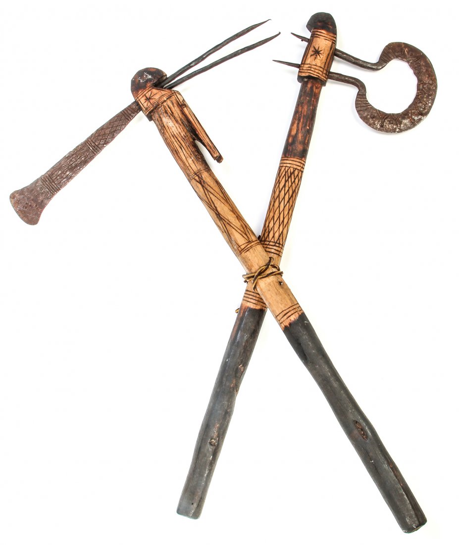 2 Ethnographic Primitive Axes: 2 Ethnographic Primitive Axes. Forged and incised heads attached to pyrographically decorated shafts. Obtained in the Philippines. Size: 24" x 20" x 3"