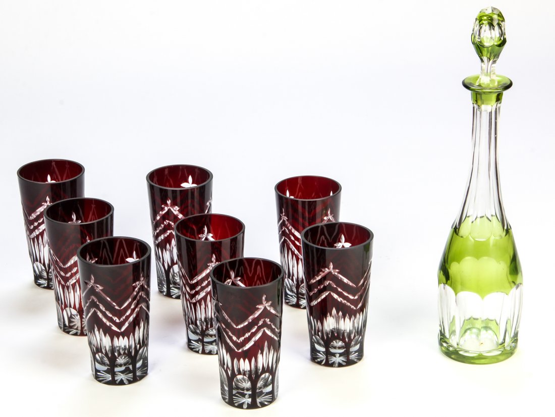 Cased Glass Tumblers and Decanter Lot. 9 Pcs.: Cased Glass Tumblers and Decanter Lot. 9 Pcs. Peridot stoppered decanter marked illegibly, possibly Val St Lambert. Also included, 8 ruby tumblers, unmarked. Size: 16.5" x 3.5" x 3.5" (largest)