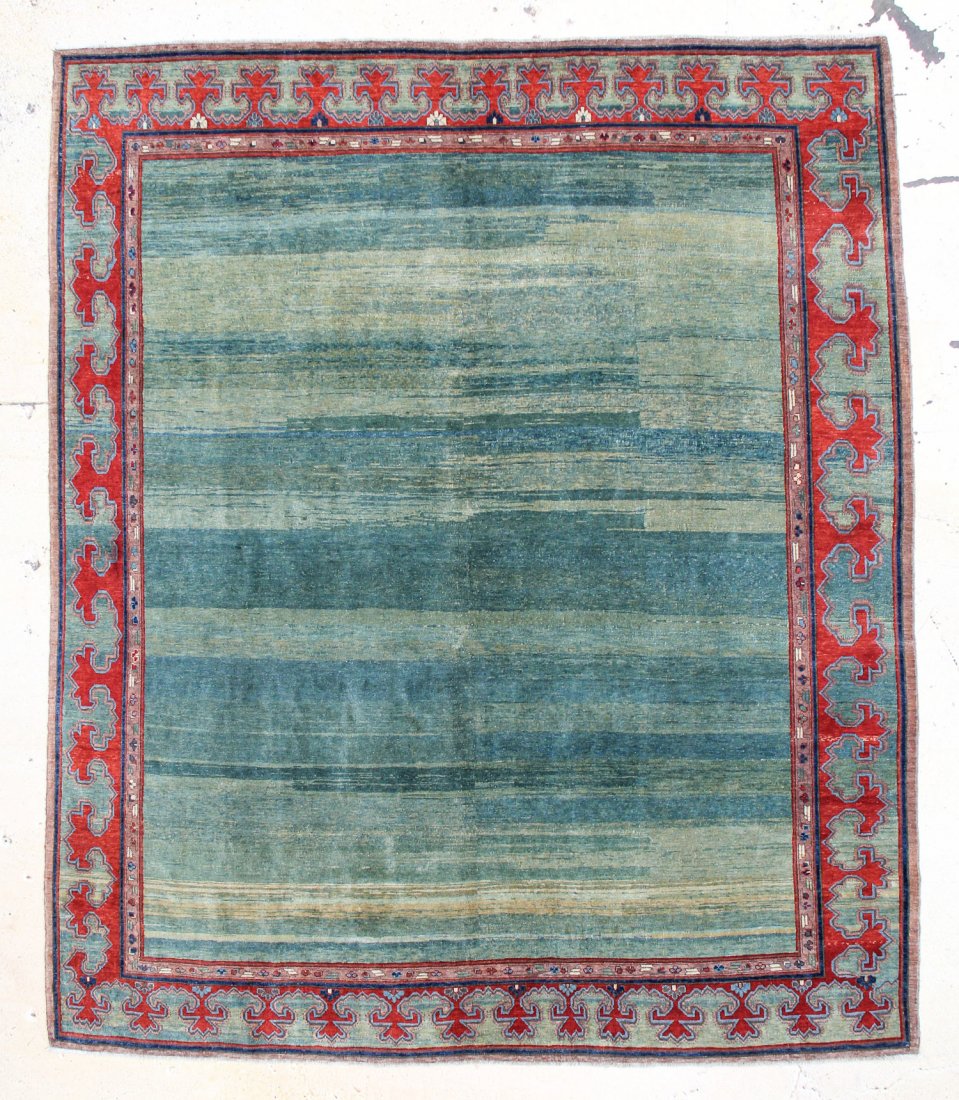 Khotan Rug: 8'10" x 10"6": Khotan Rug, Turkey, modern, natural dyes, plain field of undulating shades of green, lustrous wool. Size: 8'10" x 10"6". Cost for us to pack and ship this item via UPS GROUND in the continental USA (i